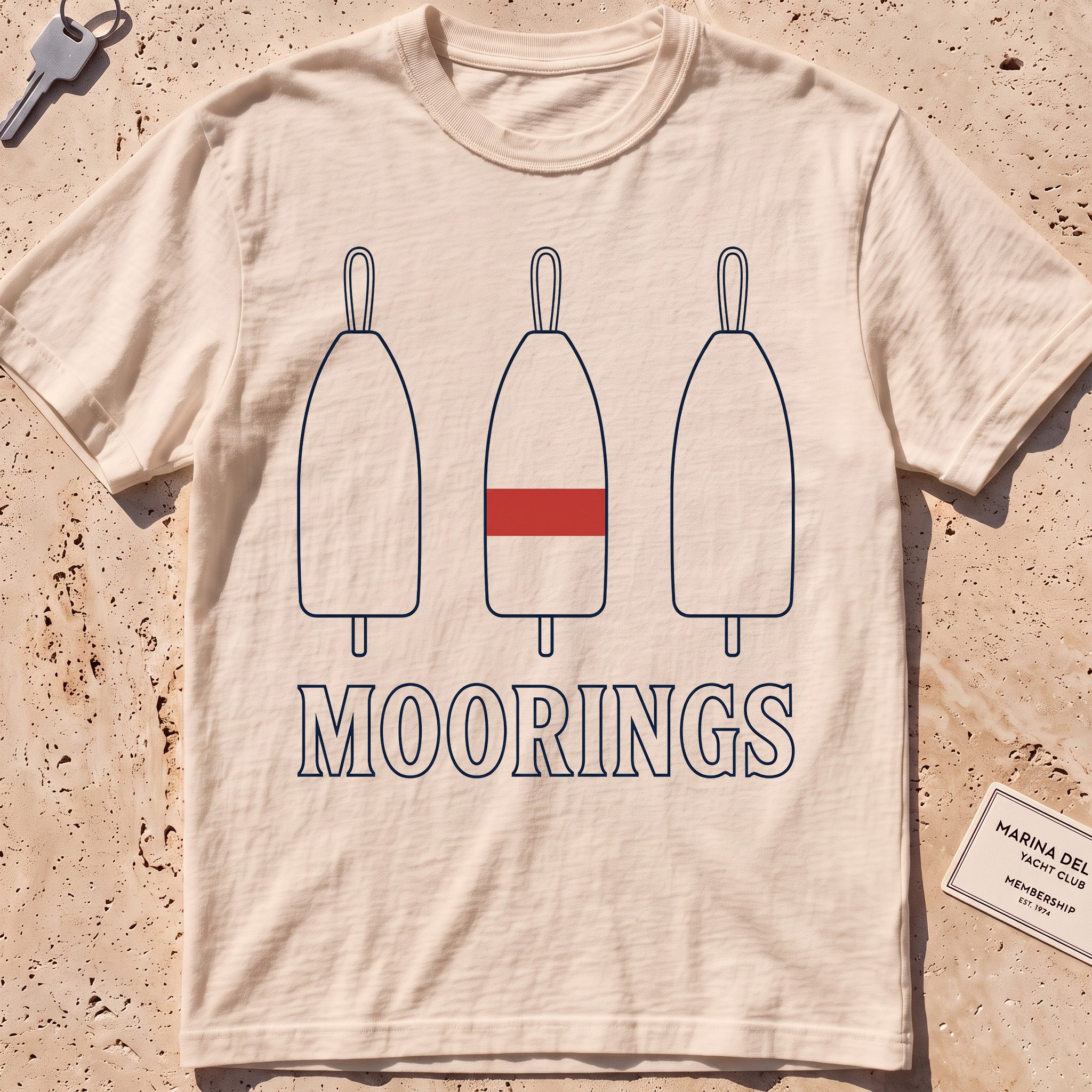 ivory heavyweight tee with three mooring buoys and "Moorings" text.
