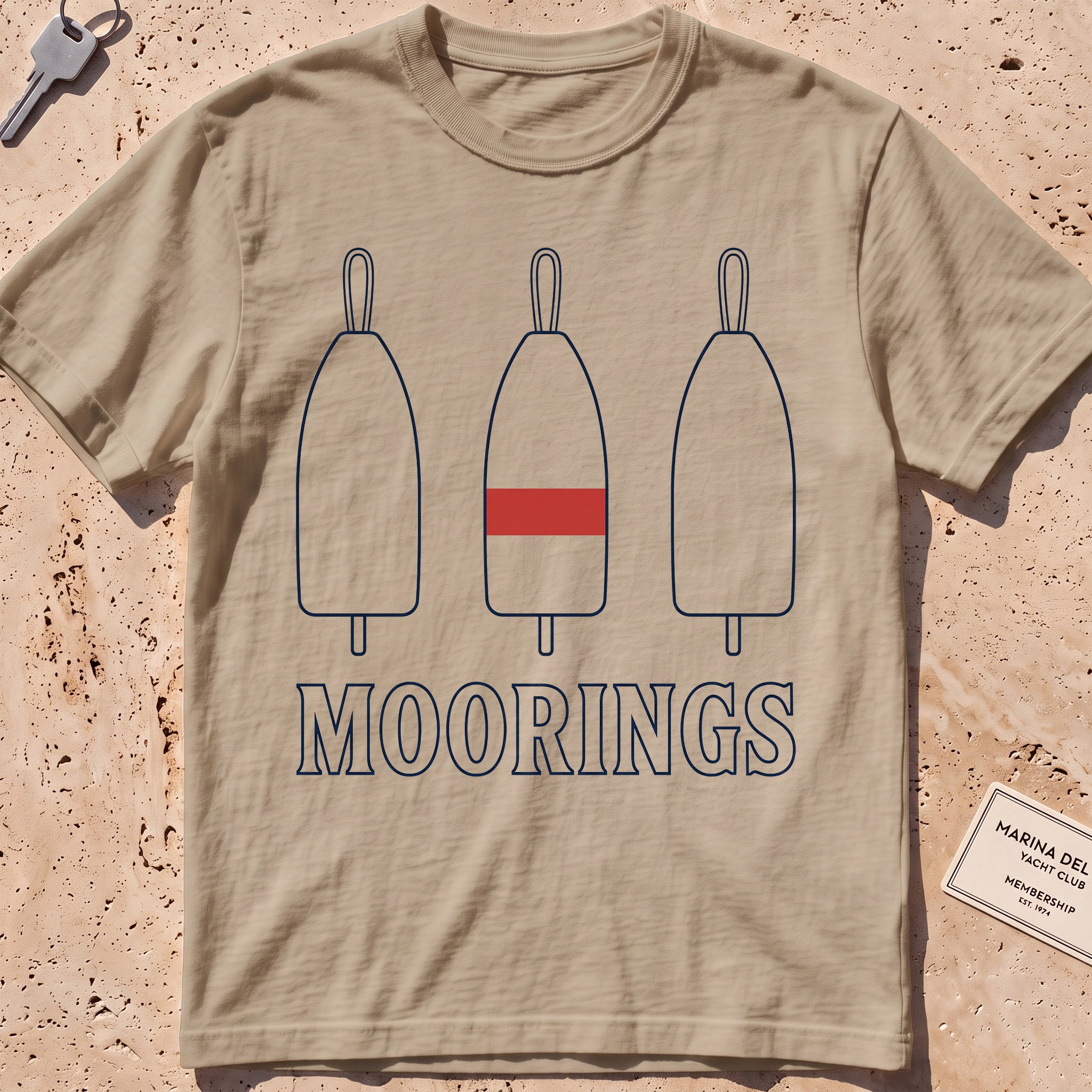 khaki heavyweight tee with three mooring buoys and "Moorings" text.