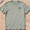 bay heavyweight tee with a small lighthouse crest graphic.