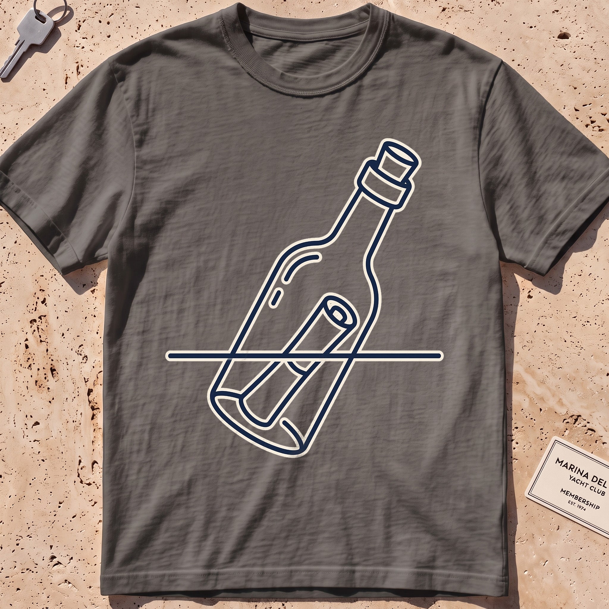 Pepper heavyweight tee with a single-line message-in-a-bottle "Adrift" graphic