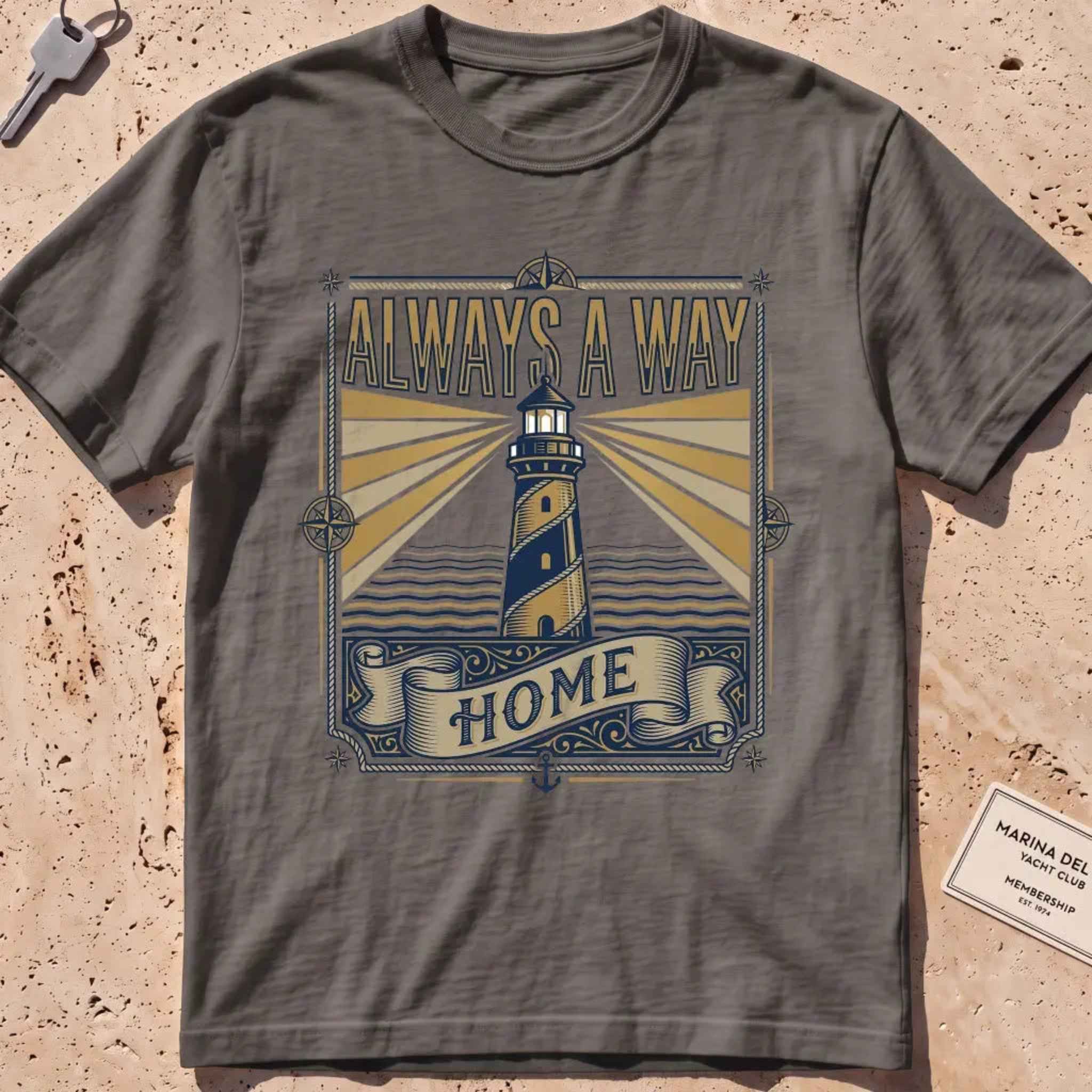 Pepper heavyweight tee with a vintage engraved lighthouse badge and "Always a Way Home" text.