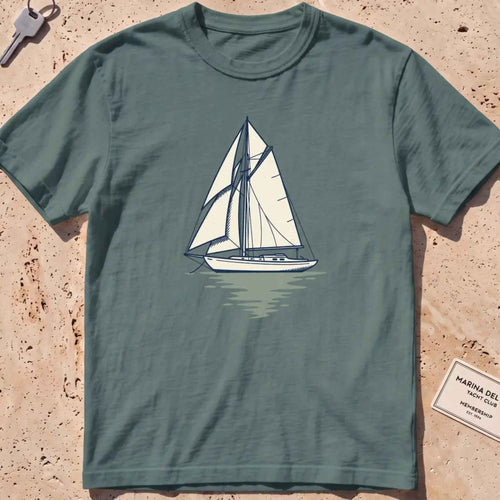 Blue spruce heavyweight tee with a two-tone yacht at anchor and a small script wordmark.