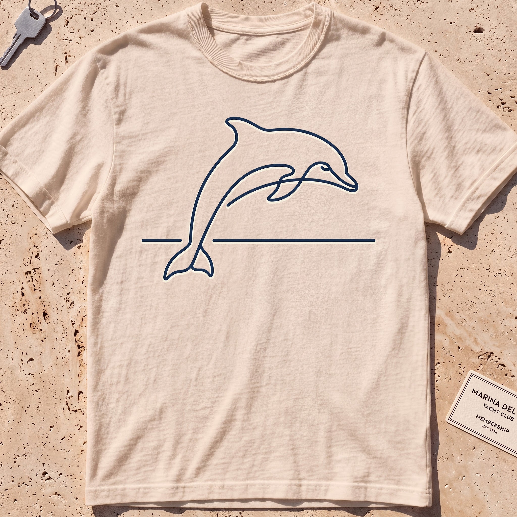 Ivory heavyweight tee with a single-line arcing dolphin graphic.