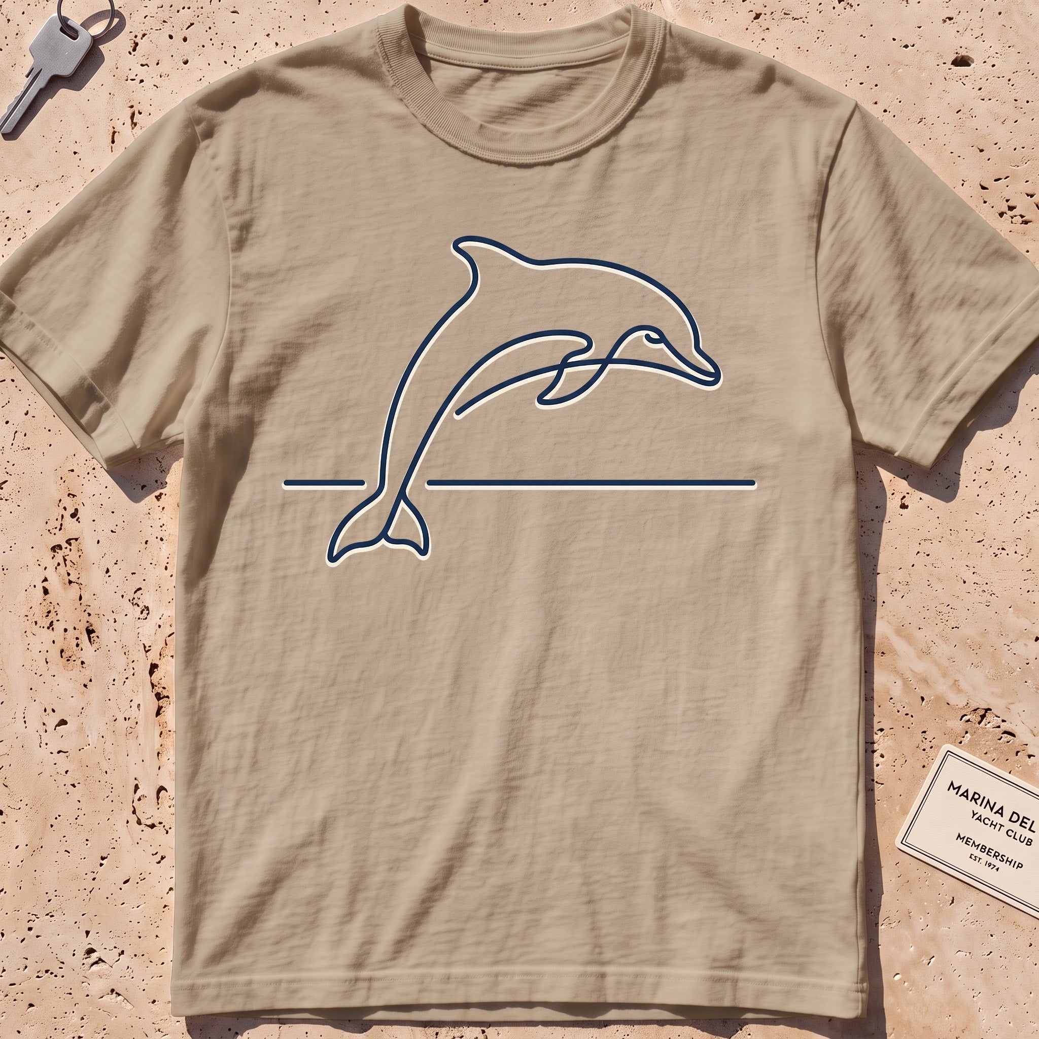 Khaki heavyweight tee with a single-line arcing dolphin graphic.