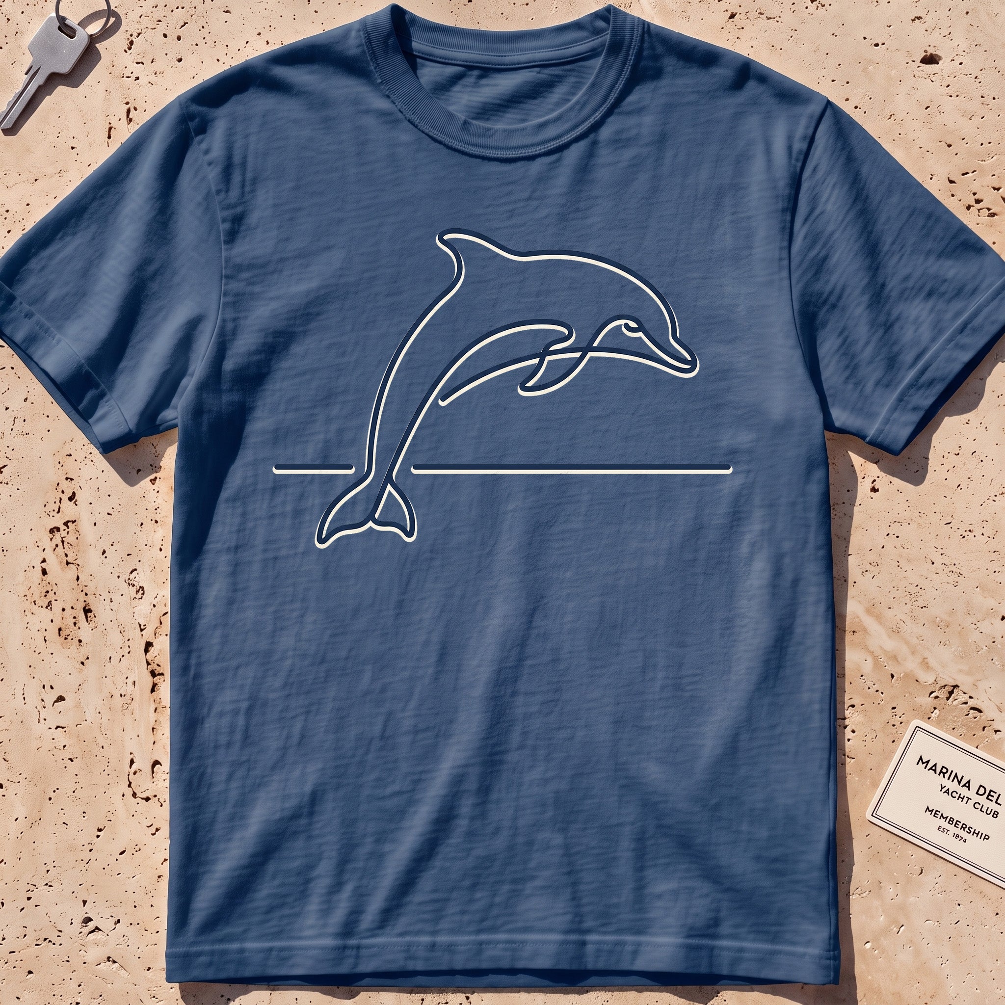 Midnight heavyweight tee with a single-line arcing dolphin graphic.