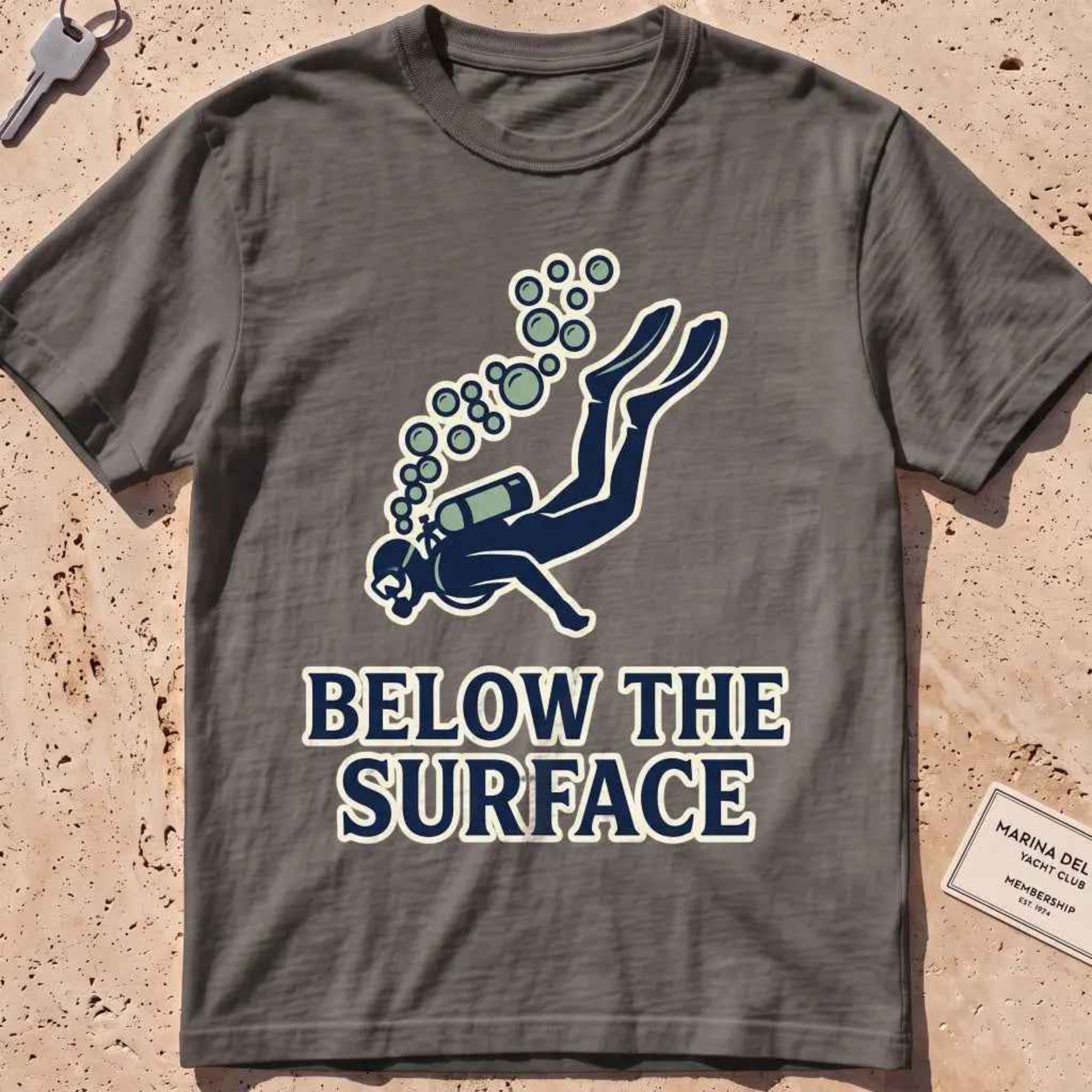 Pepper heavyweight tee with a minimalist scuba diver and rising bubbles graphic.