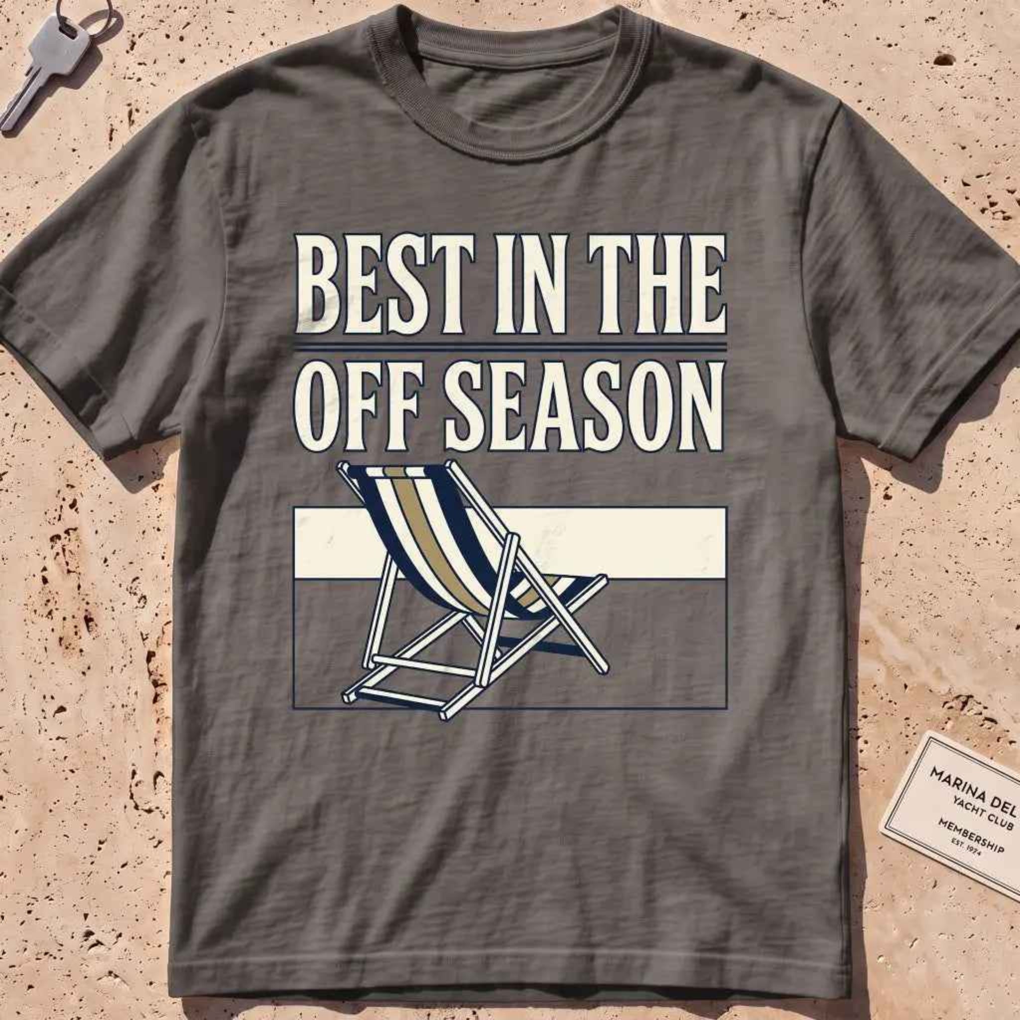 Pepper heavyweight tee with "Best in the Off Season" text and an empty deckchair graphic.