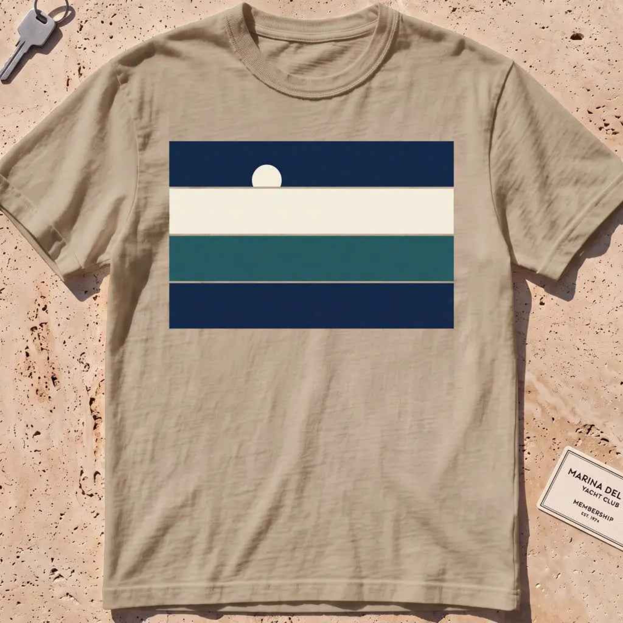 Khaki heavyweight tee with stacked sea-and-sky colour bands and a rising moon.