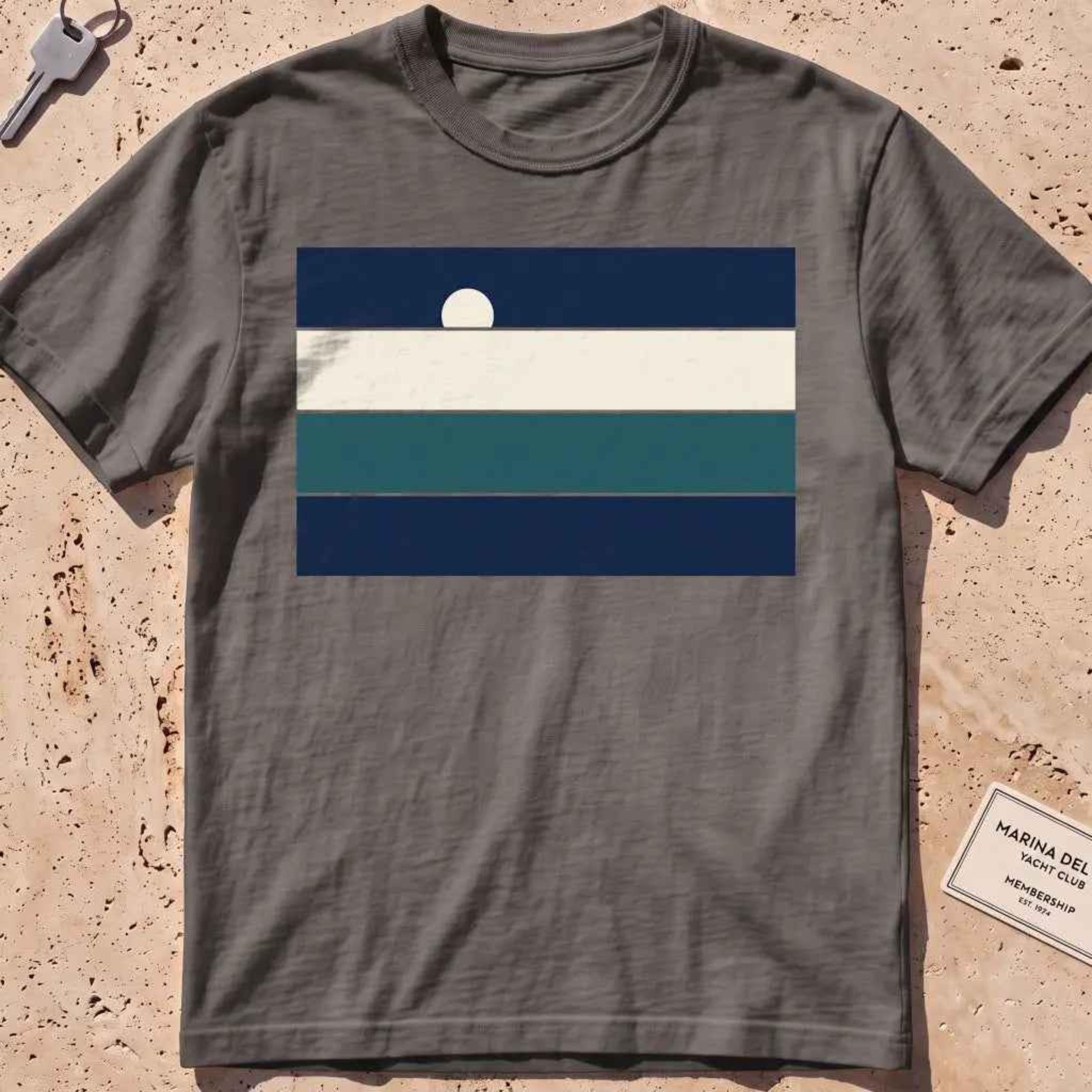 Pepper heavyweight tee with stacked sea-and-sky colour bands and a rising moon.