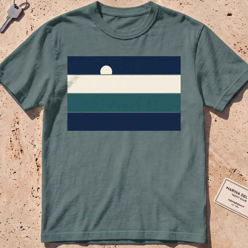 Blue spruce heavyweight tee with stacked sea-and-sky colour bands and a rising moon.