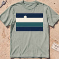 Bay heavyweight tee with stacked sea-and-sky colour bands and a rising moon.