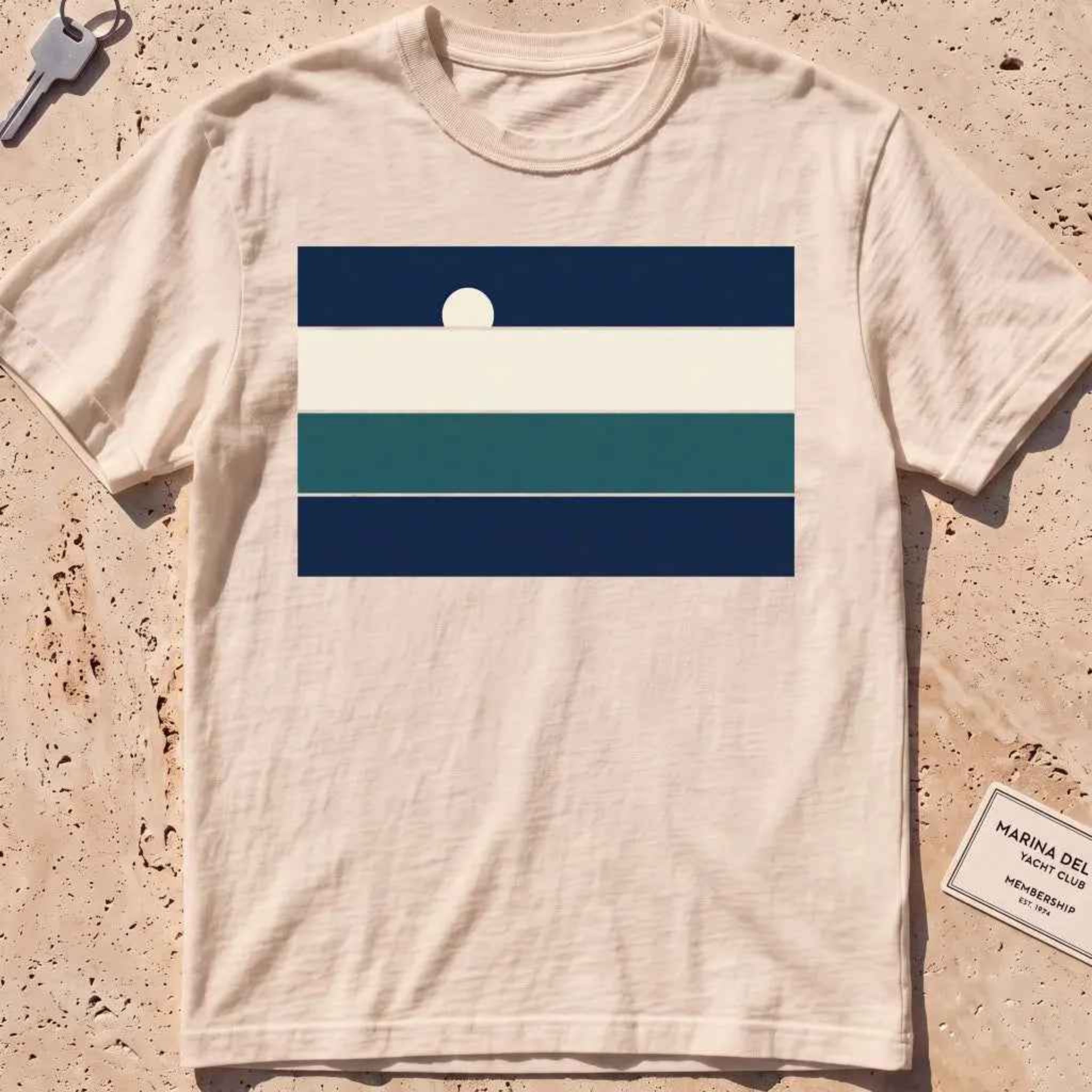 Ivory heavyweight tee with stacked sea-and-sky colour bands and a rising moon.