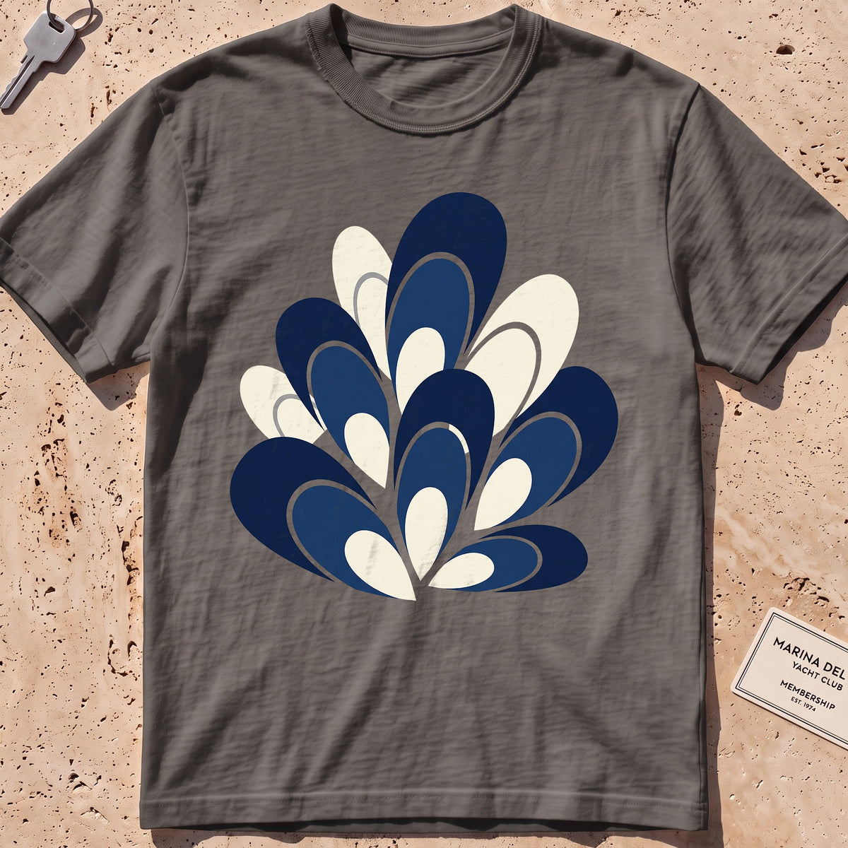 pepper heavyweight tee with a flat-geometric blue mussel cluster graphic.
