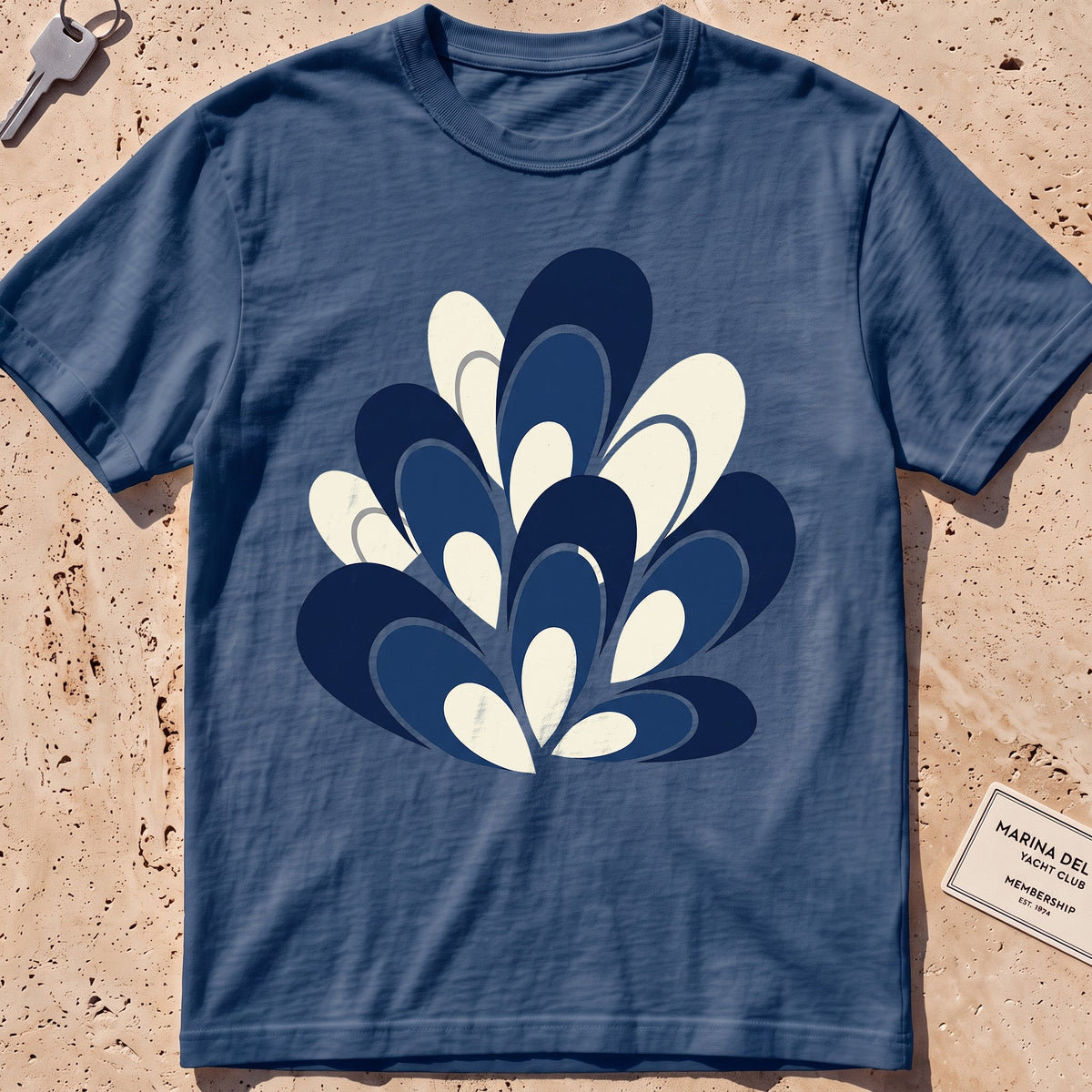 midnight heavyweight tee with a flat-geometric blue mussel cluster graphic.