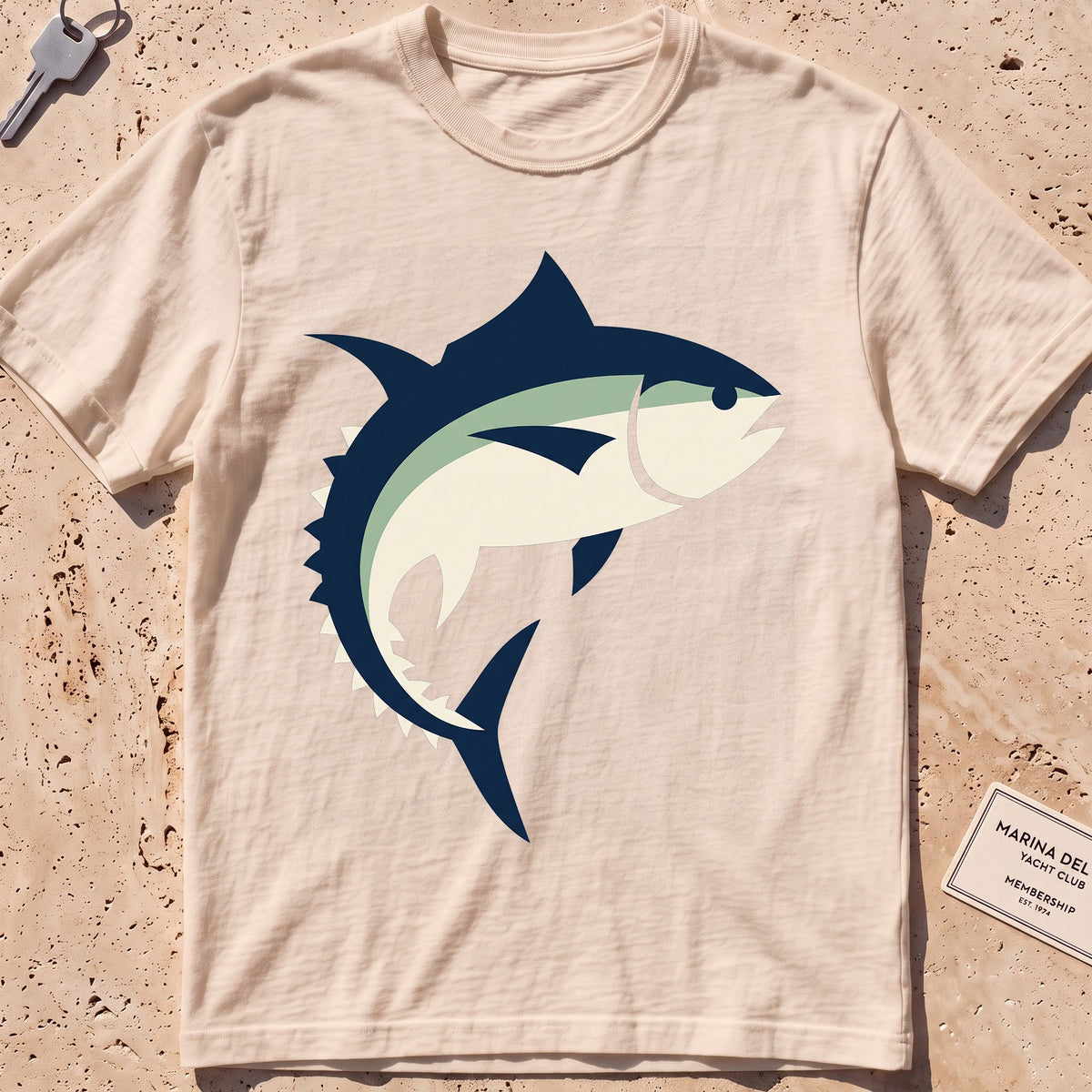 ivory heavyweight tee with a flat-geometric bluefin tuna graphic.