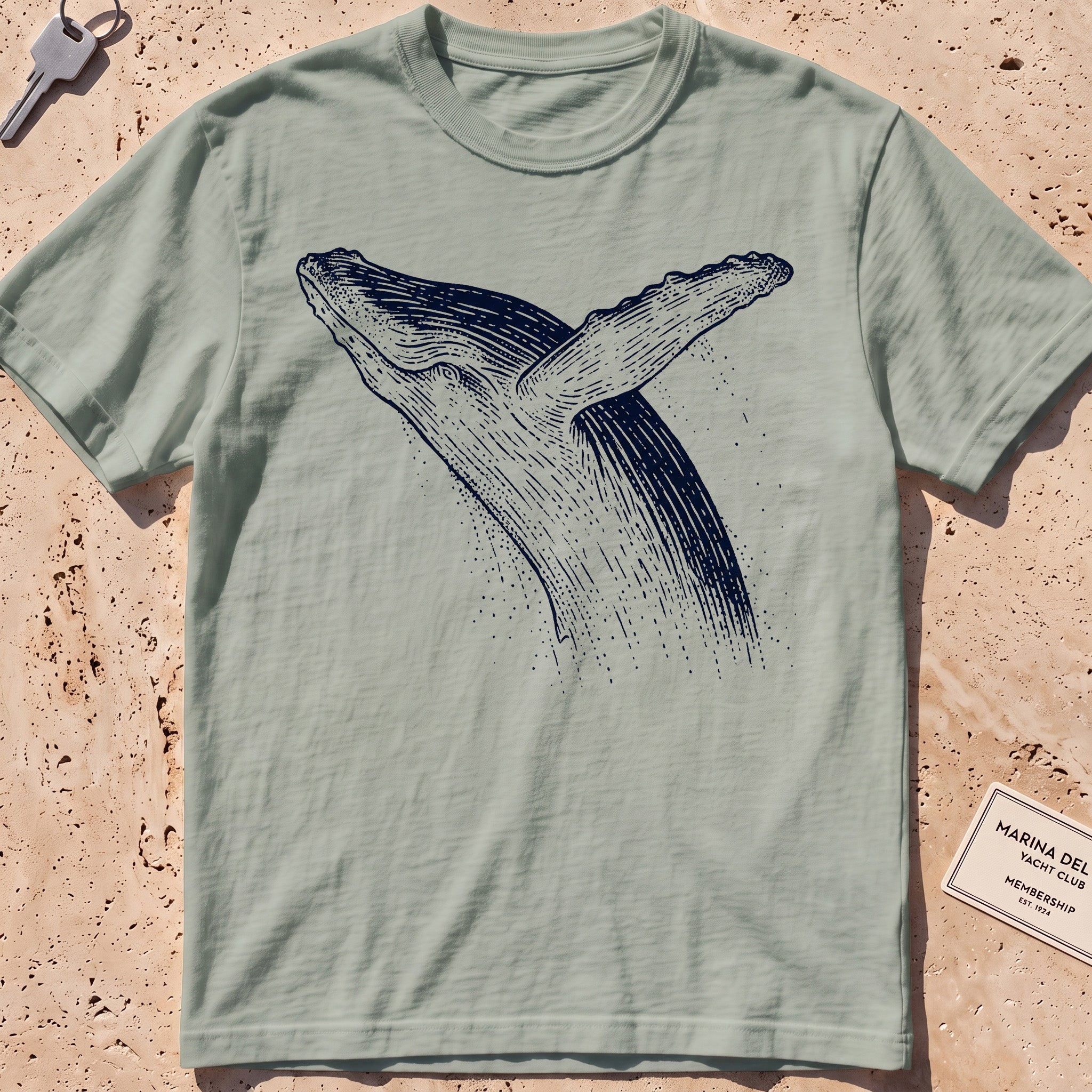 bay heavyweight tee with an etched breaching whale leaping from the water.