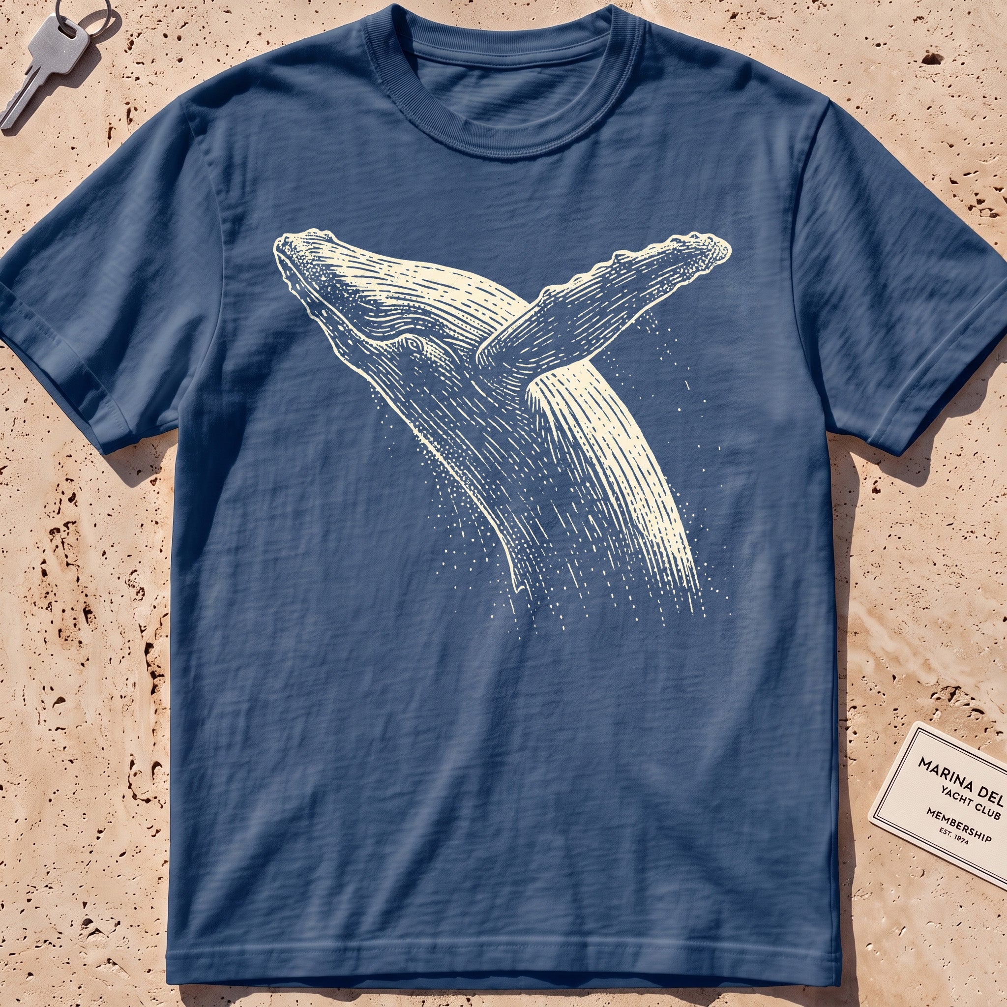 midnight heavyweight tee with an etched breaching whale leaping from the water.