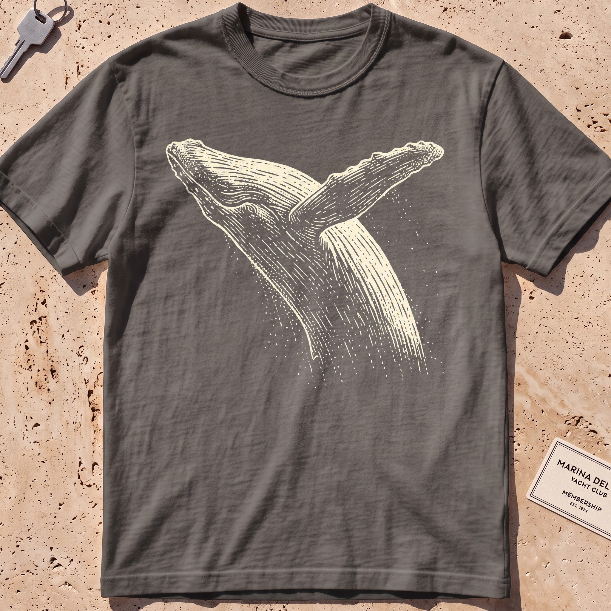 pepper heavyweight tee with an etched breaching whale leaping from the water.