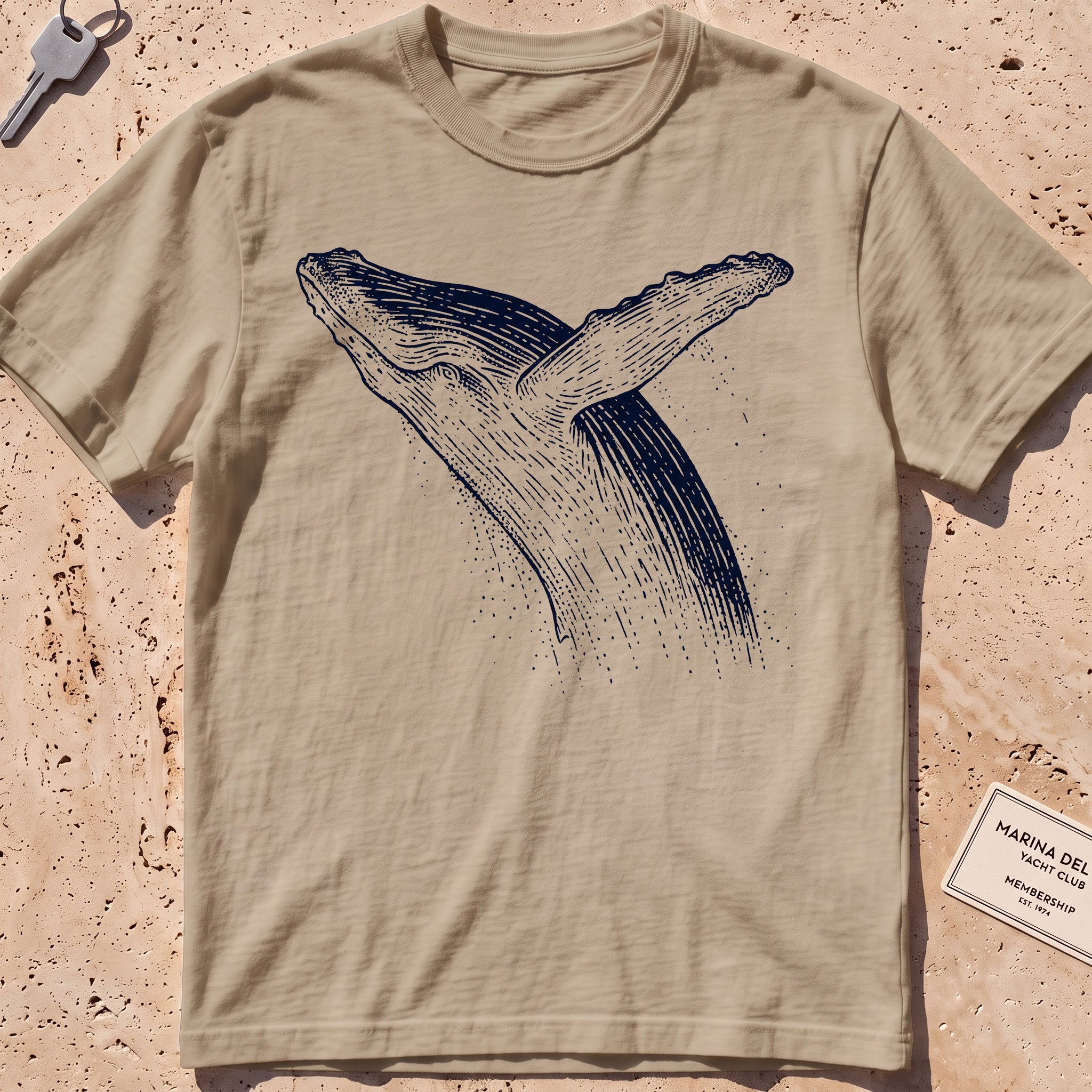 khaki heavyweight tee with an etched breaching whale leaping from the water.