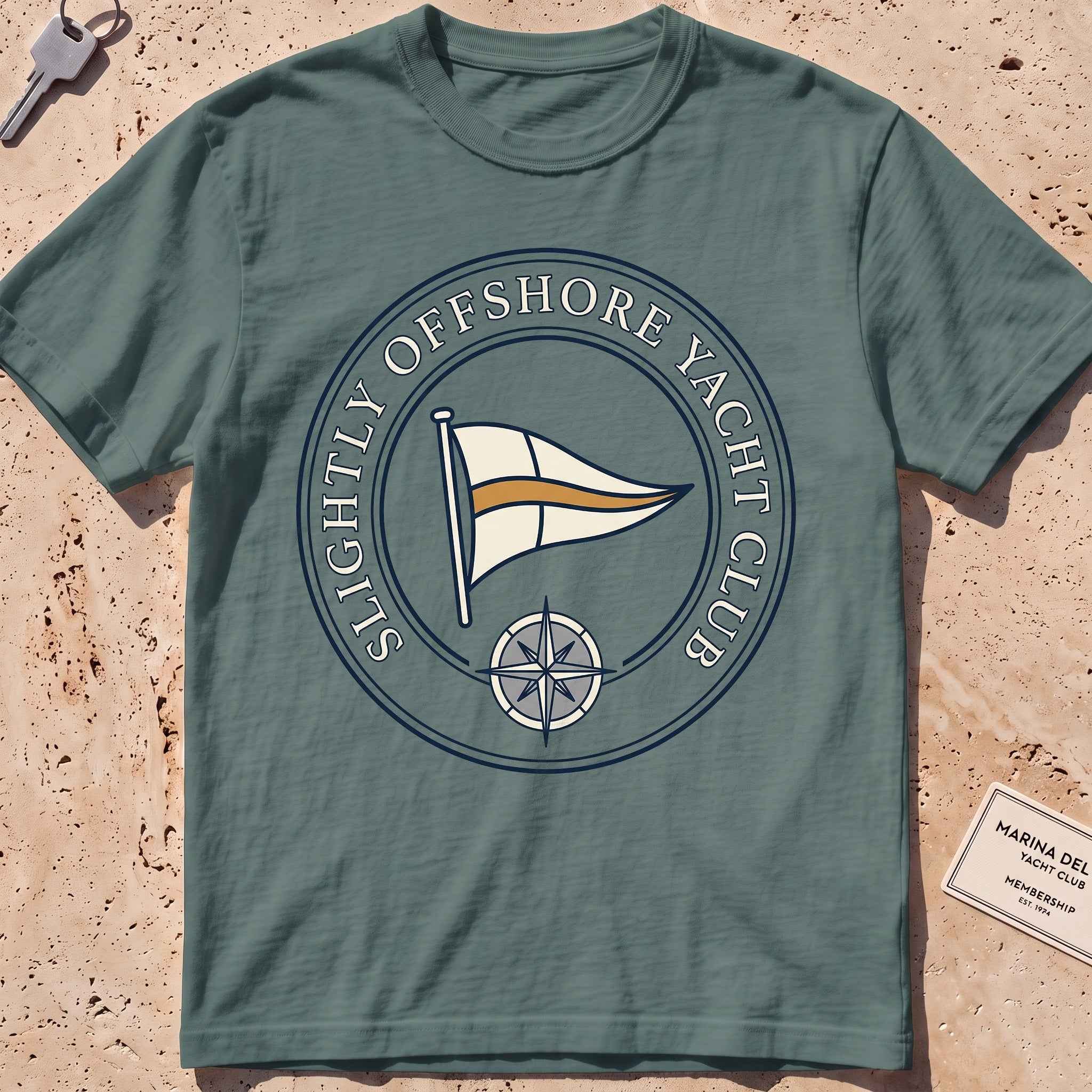 Blue spruce heavyweight tee with a bold yacht-club burgee crest graphic.
