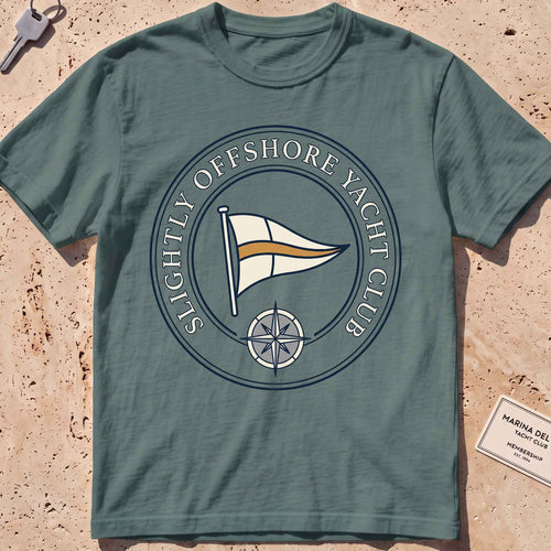 Blue spruce heavyweight tee with a bold yacht-club burgee crest graphic.