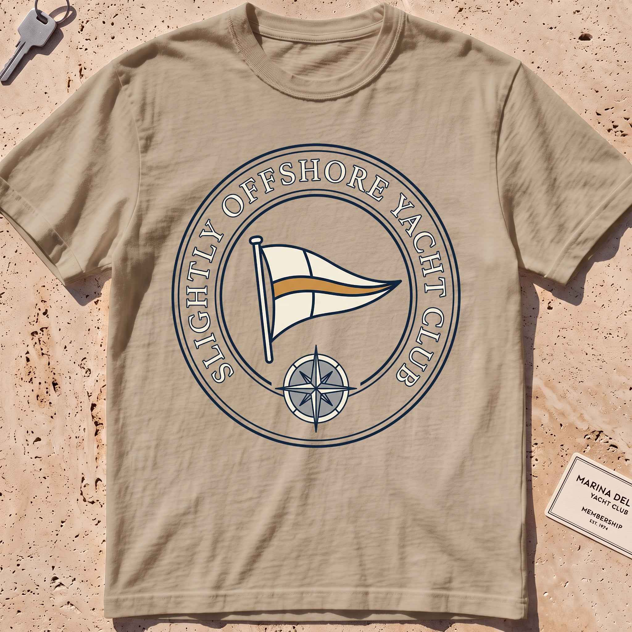 Khaki heavyweight tee with a bold yacht-club burgee crest graphic.