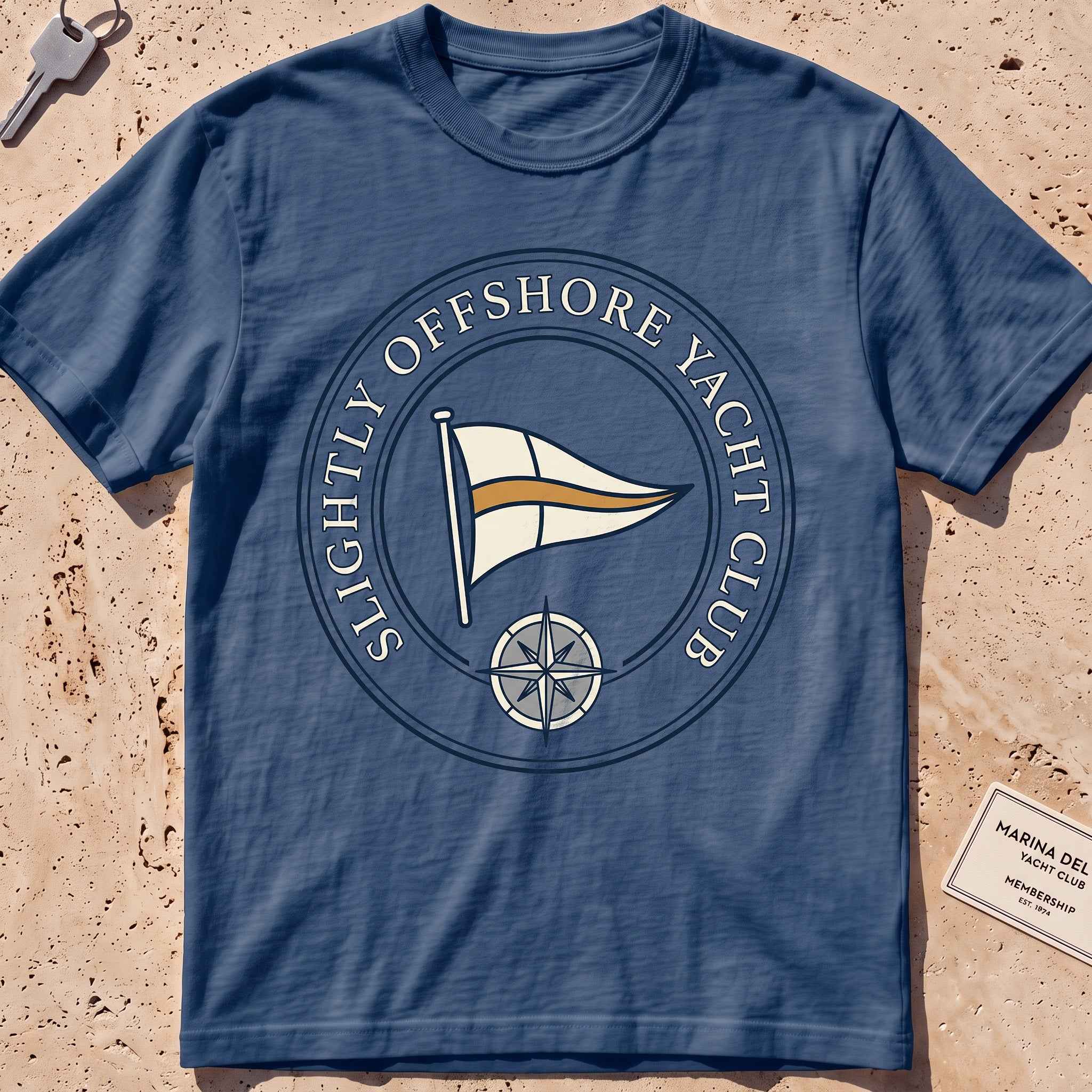 Midnight heavyweight tee with a bold yacht-club burgee crest graphic.
