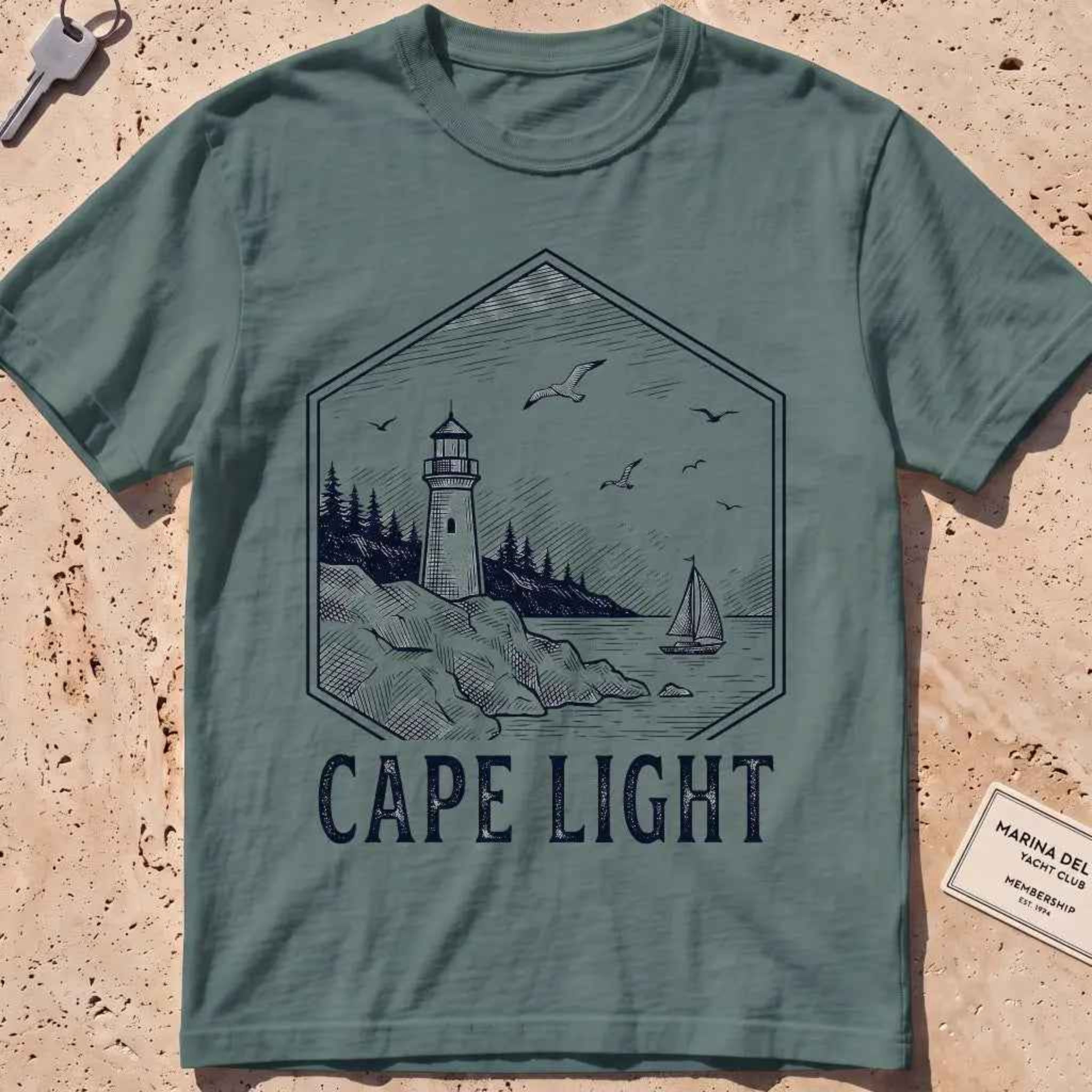 Blue spruce heavyweight tee with an etched vintage lighthouse badge graphic.