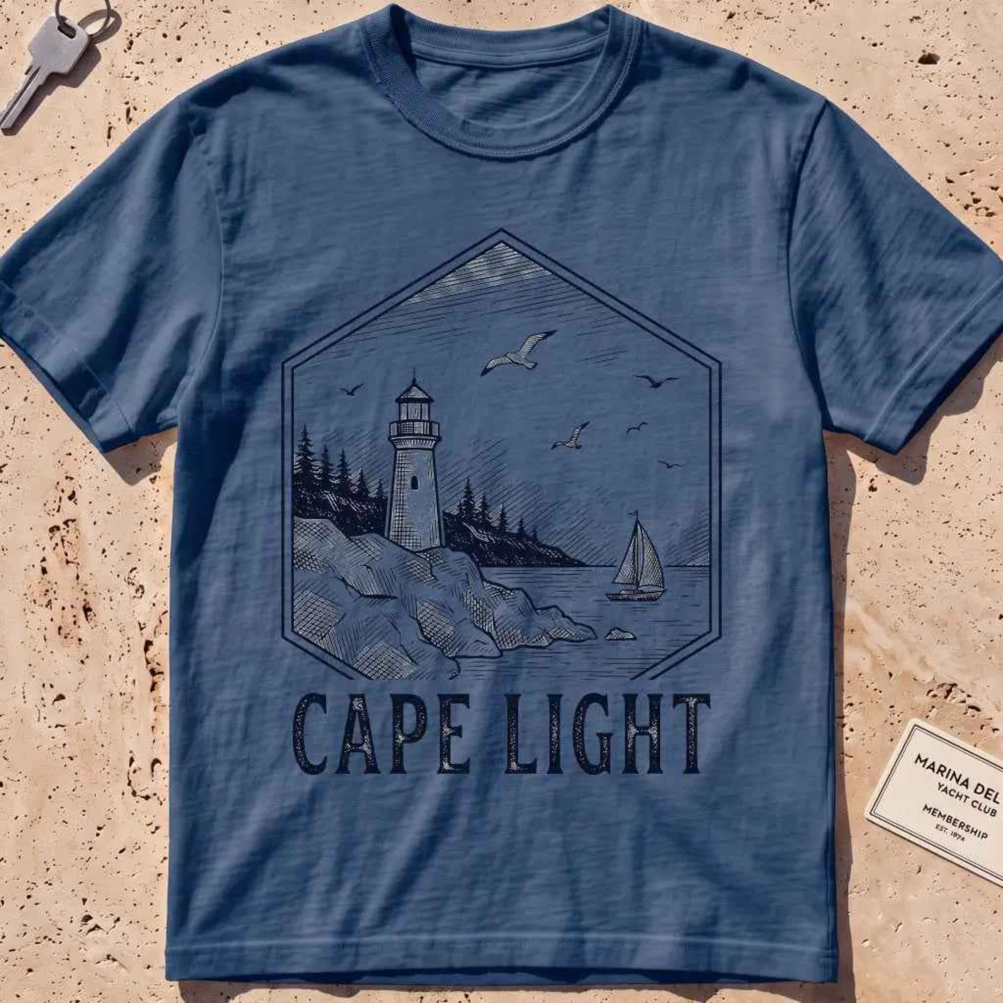 Midnight heavyweight tee with an etched vintage lighthouse badge graphic.