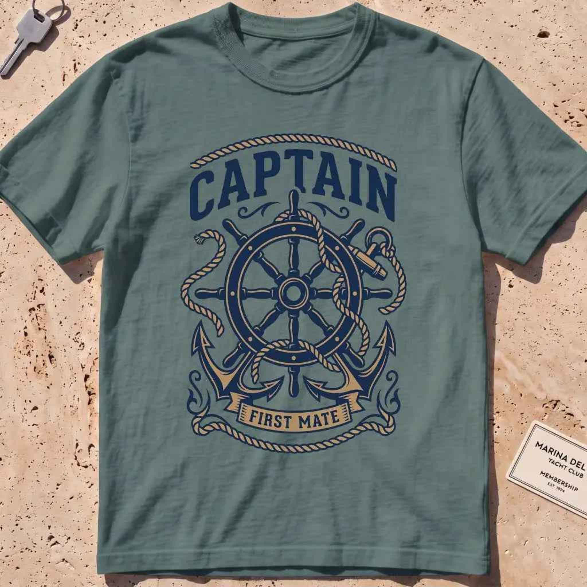 Blue spruce heavyweight tee with a ship's wheel, anchor and rope nautical graphic
