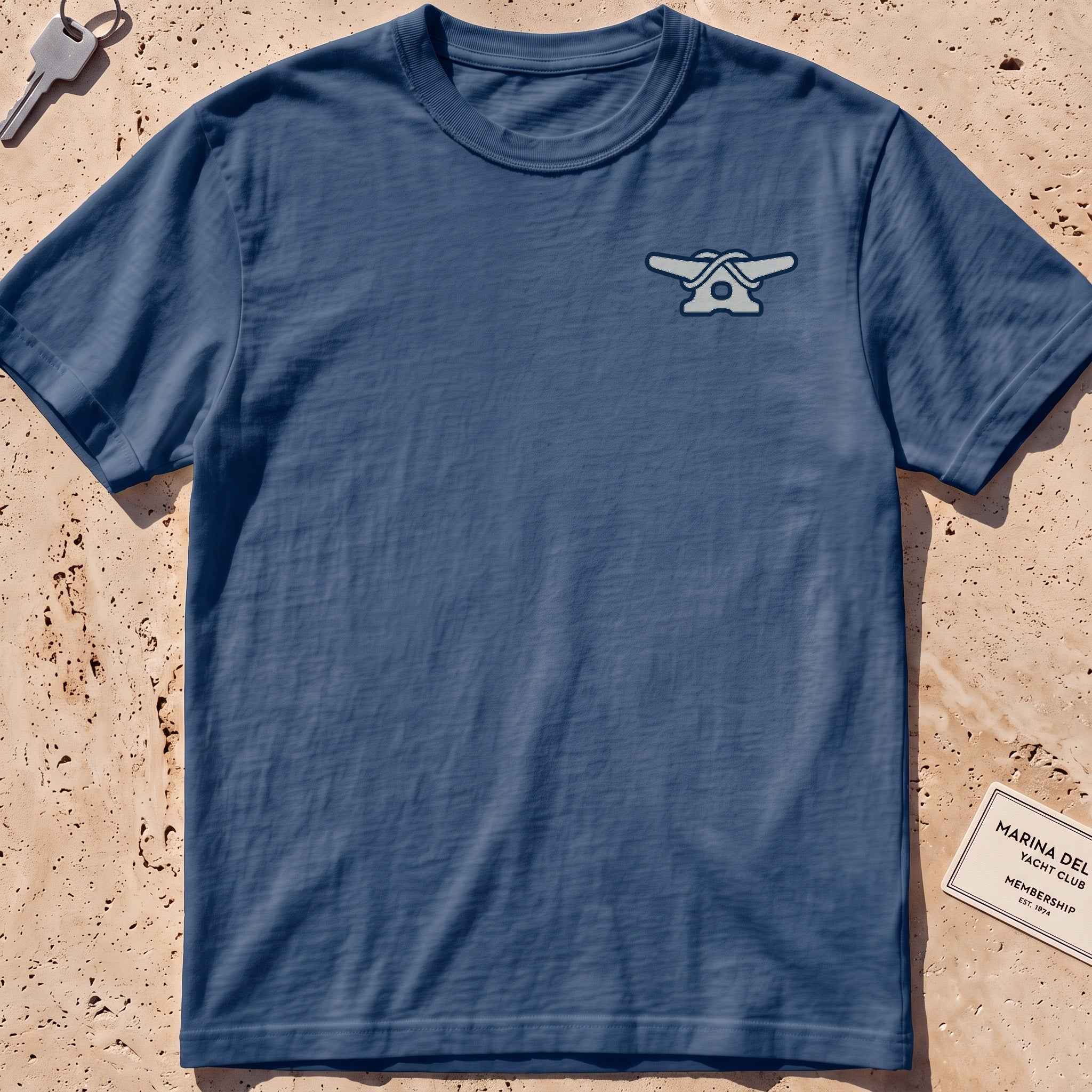 Midnight heavyweight tee with a clean dock-cleat crest graphic.