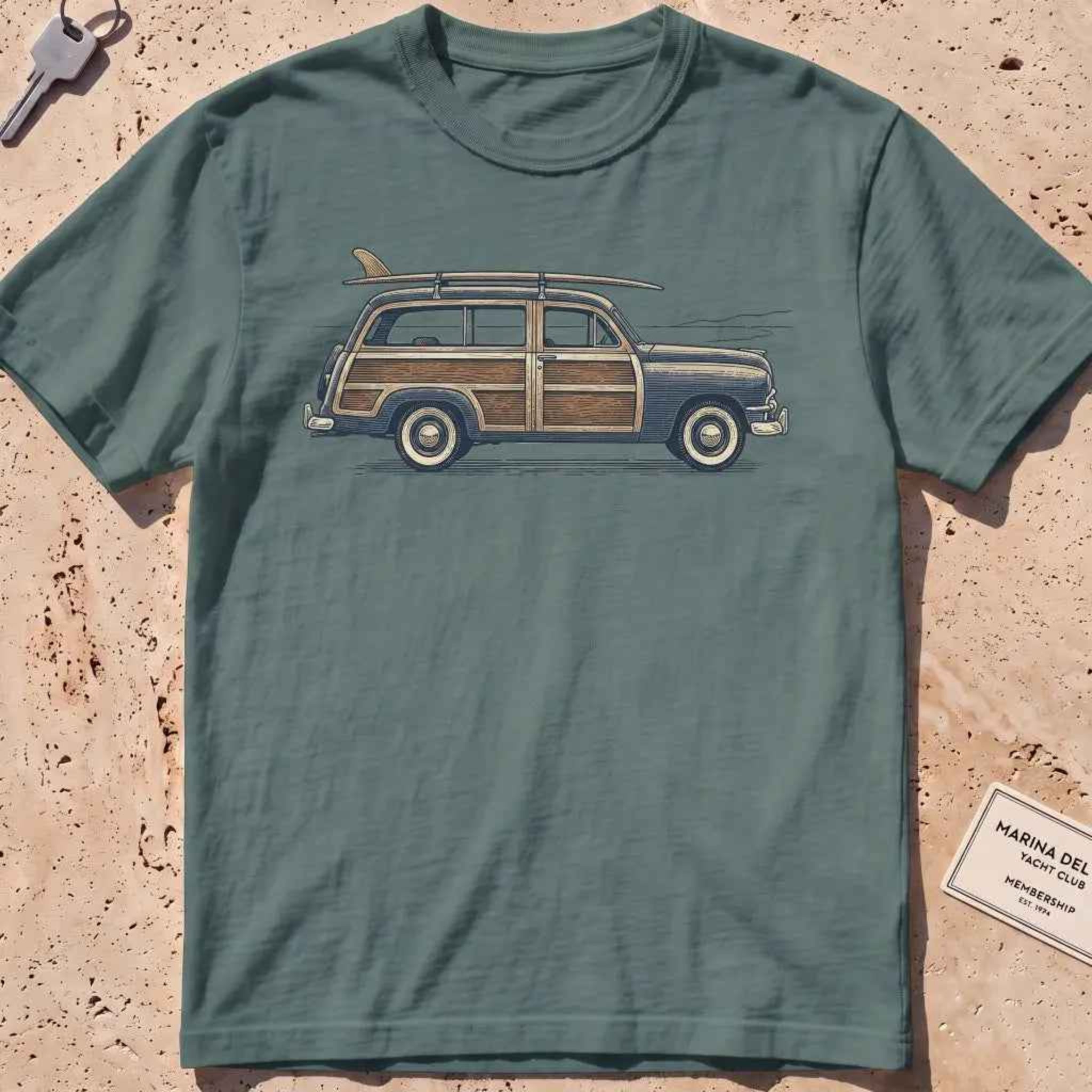 Blue spruce heavyweight tee with an engraved woodie wagon and surfboard graphic.