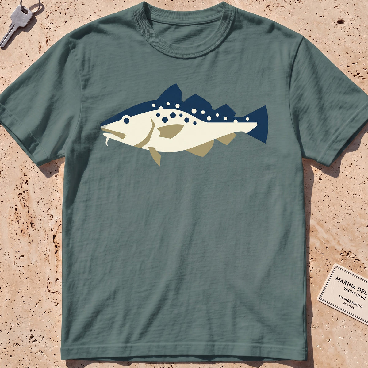 blue spruce heavyweight tee with a flat-geometric Atlantic cod graphic.