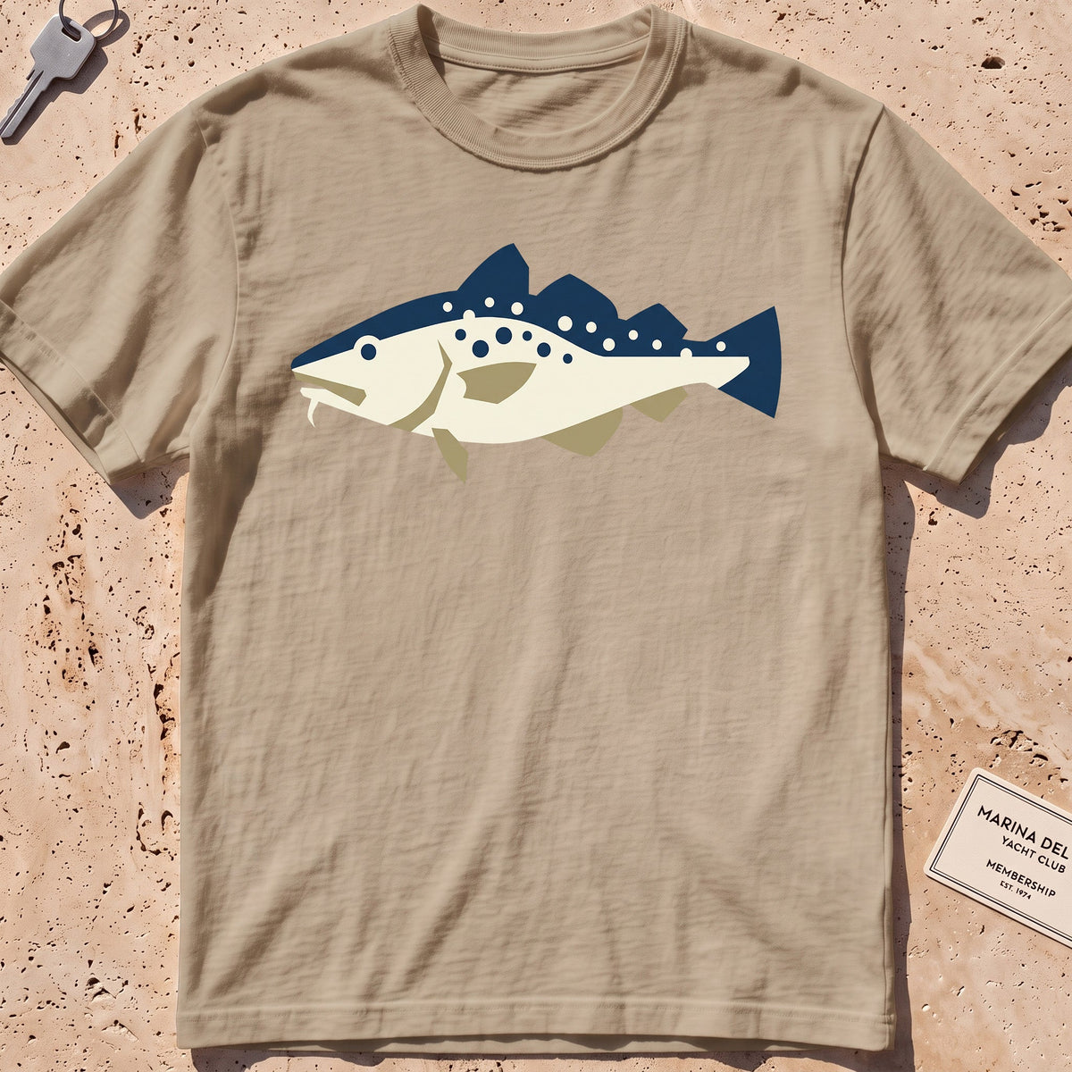 khaki heavyweight tee with a flat-geometric Atlantic cod graphic.