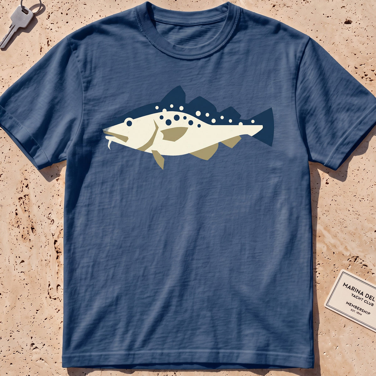 midnight heavyweight tee with a flat-geometric Atlantic cod graphic.