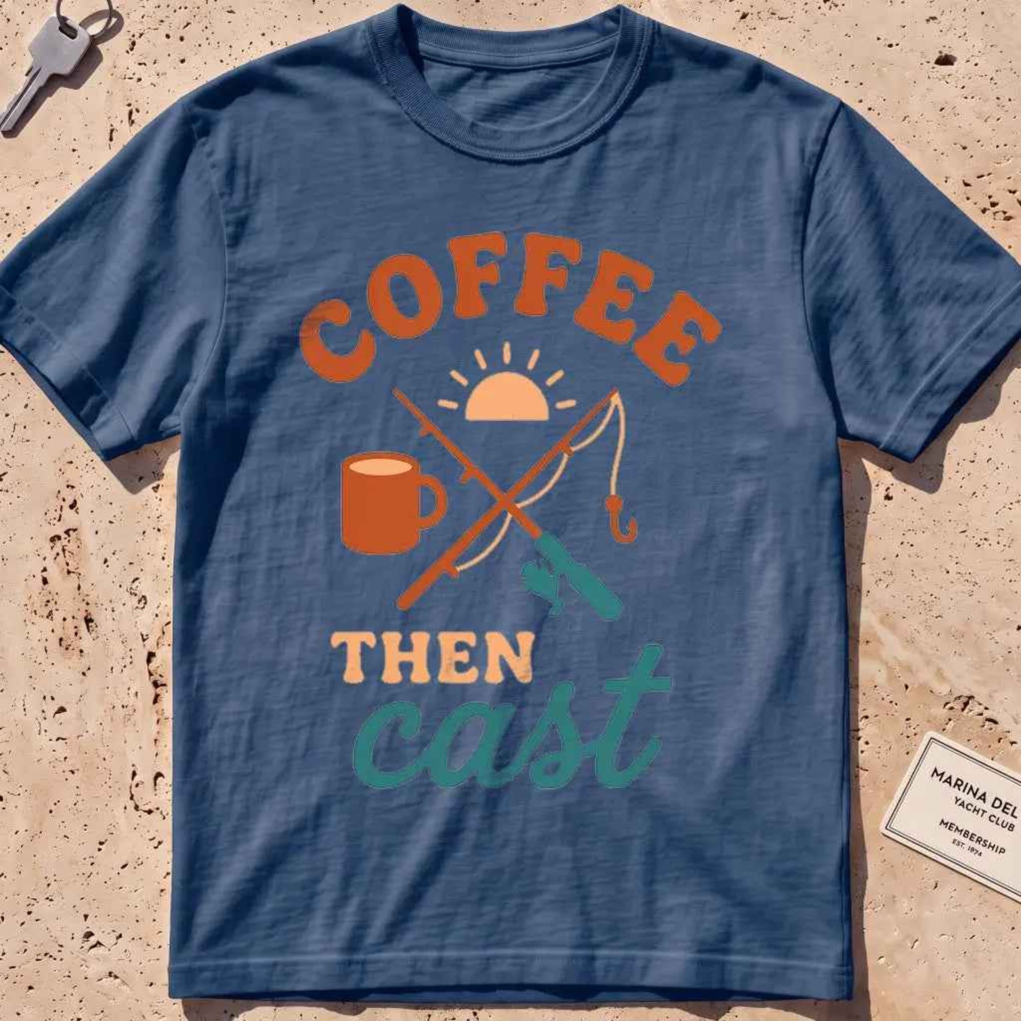 midnight heavyweight tee with a coffee mug, crossed rods and "Coffee Then Cast" text.
