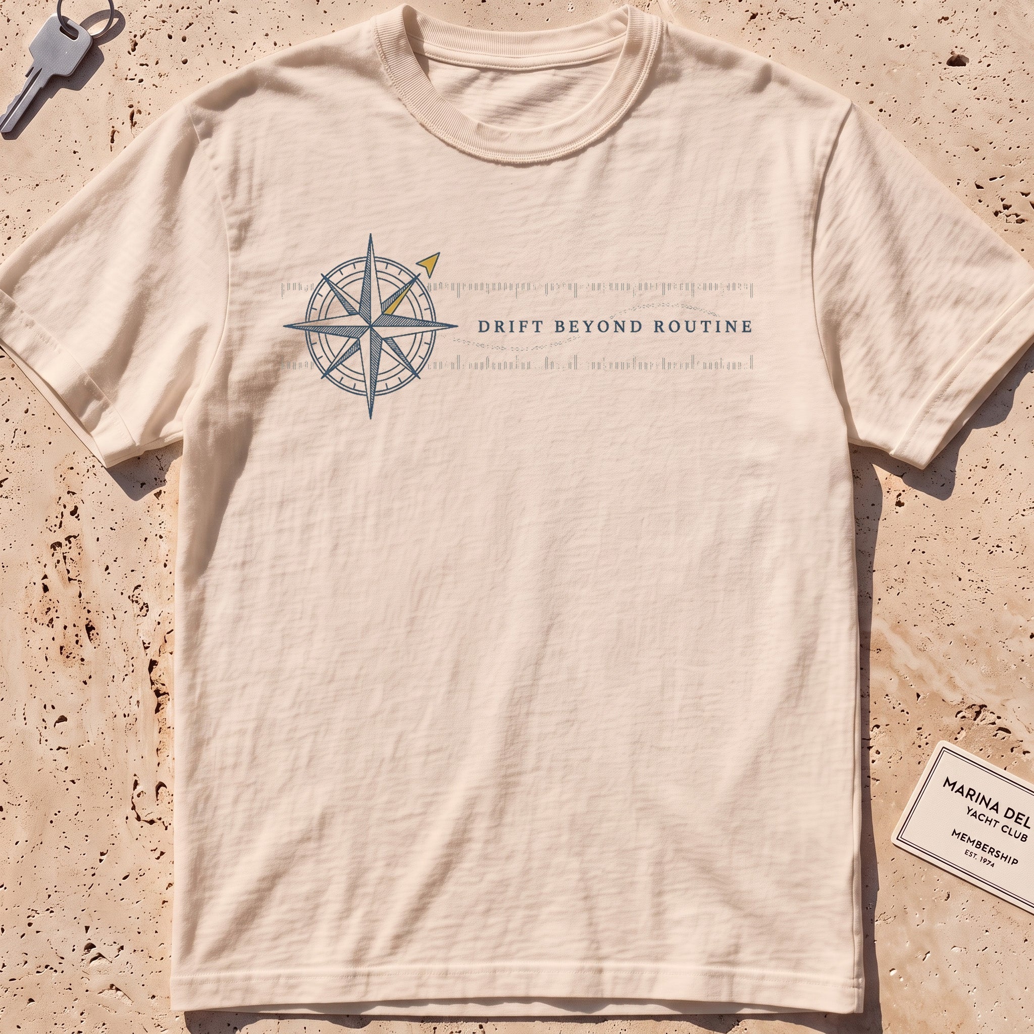 ivory heavyweight tee with a compass rose and coordinate band graphic.