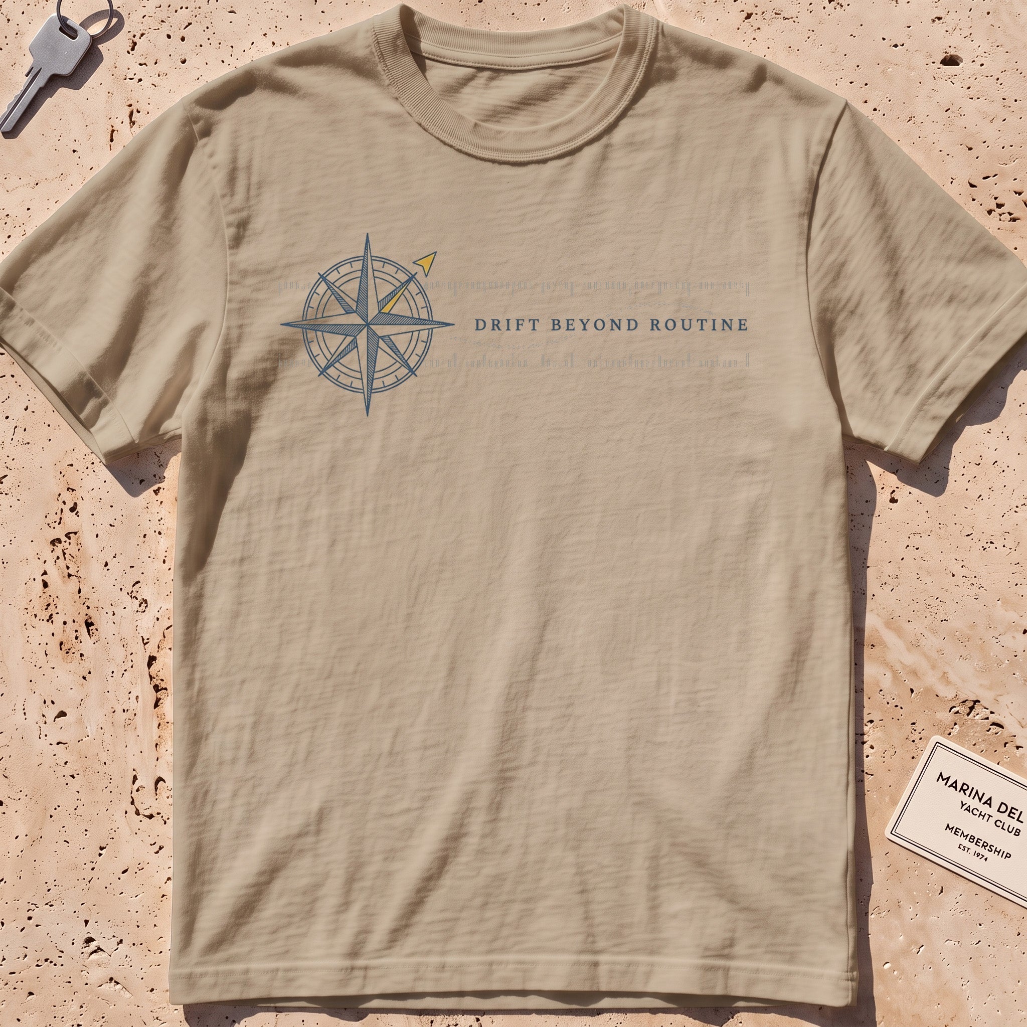 khaki heavyweight tee with a compass rose and coordinate band graphic.