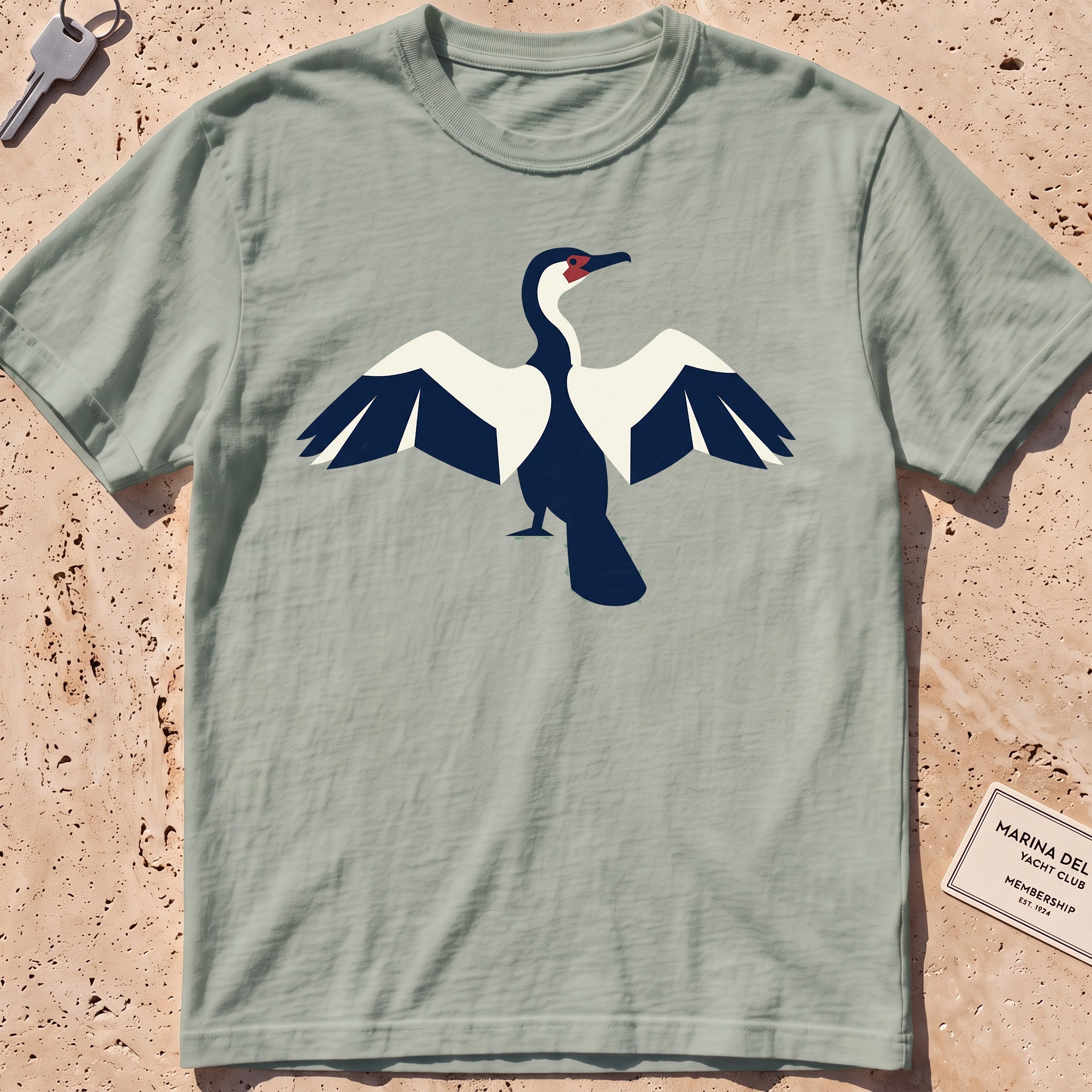 bay heavyweight tee with a flat-geometric cormorant, wings spread graphic.