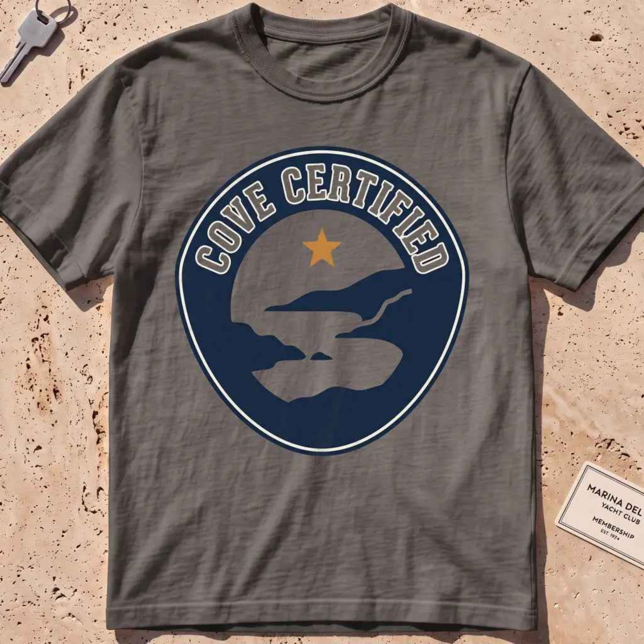 pepper heavyweight tee with a mock "Cove Certified" certification badge graphic.