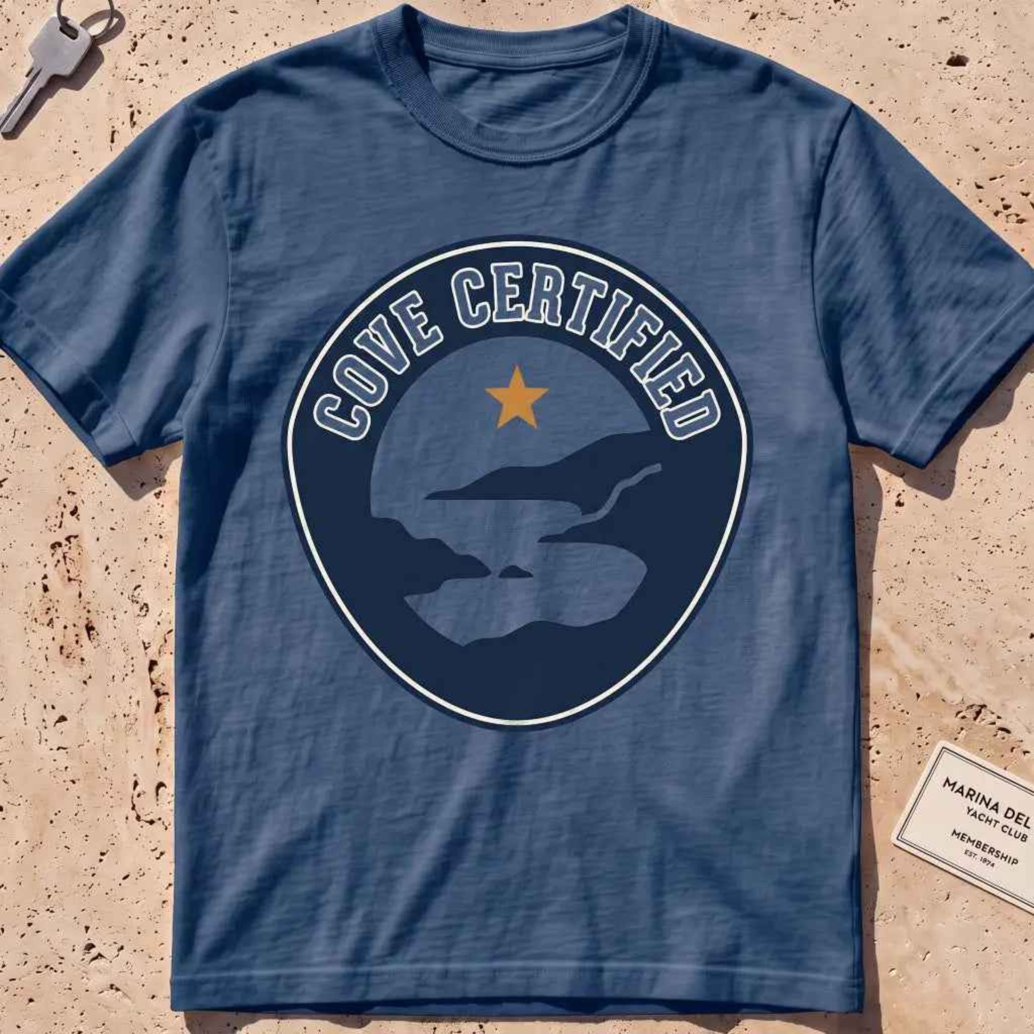midnight heavyweight tee with a mock "Cove Certified" certification badge graphic.
