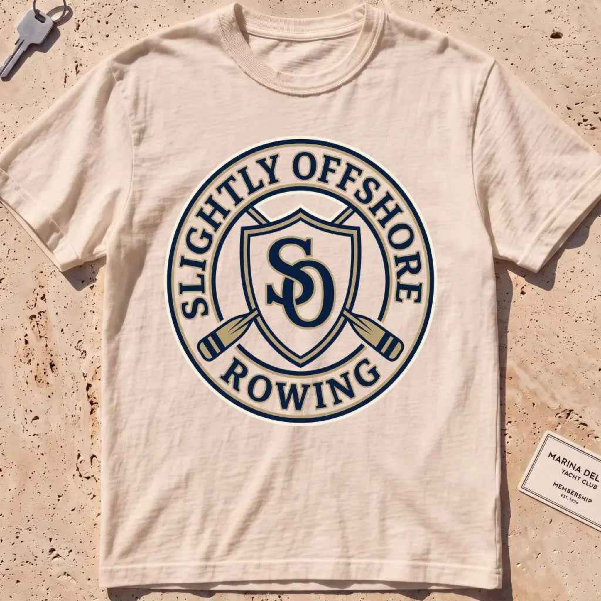 ivory heavyweight tee with an SO shield and crossed oars crest graphic.