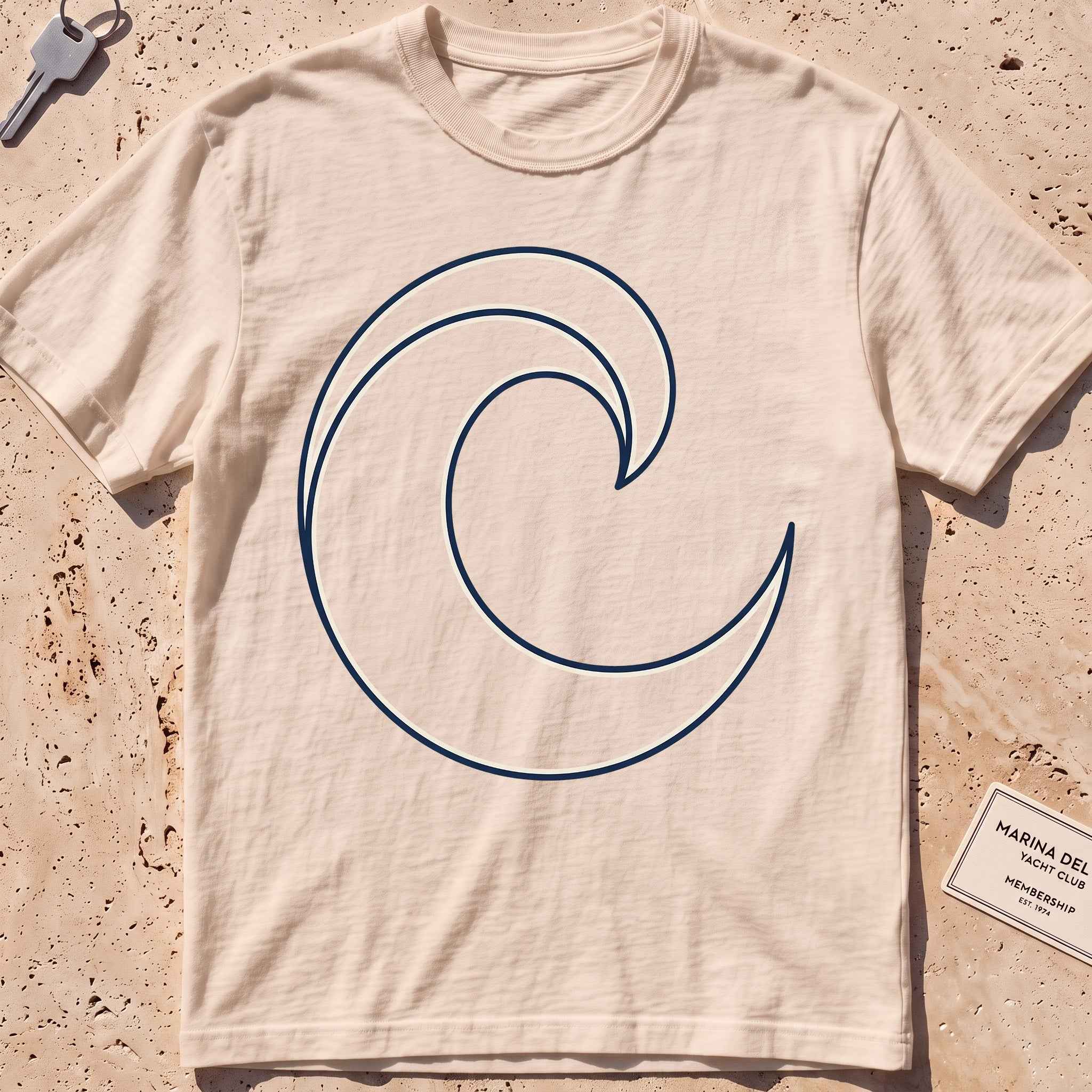 ivory heavyweight tee with a single-line breaking wave curl graphic.