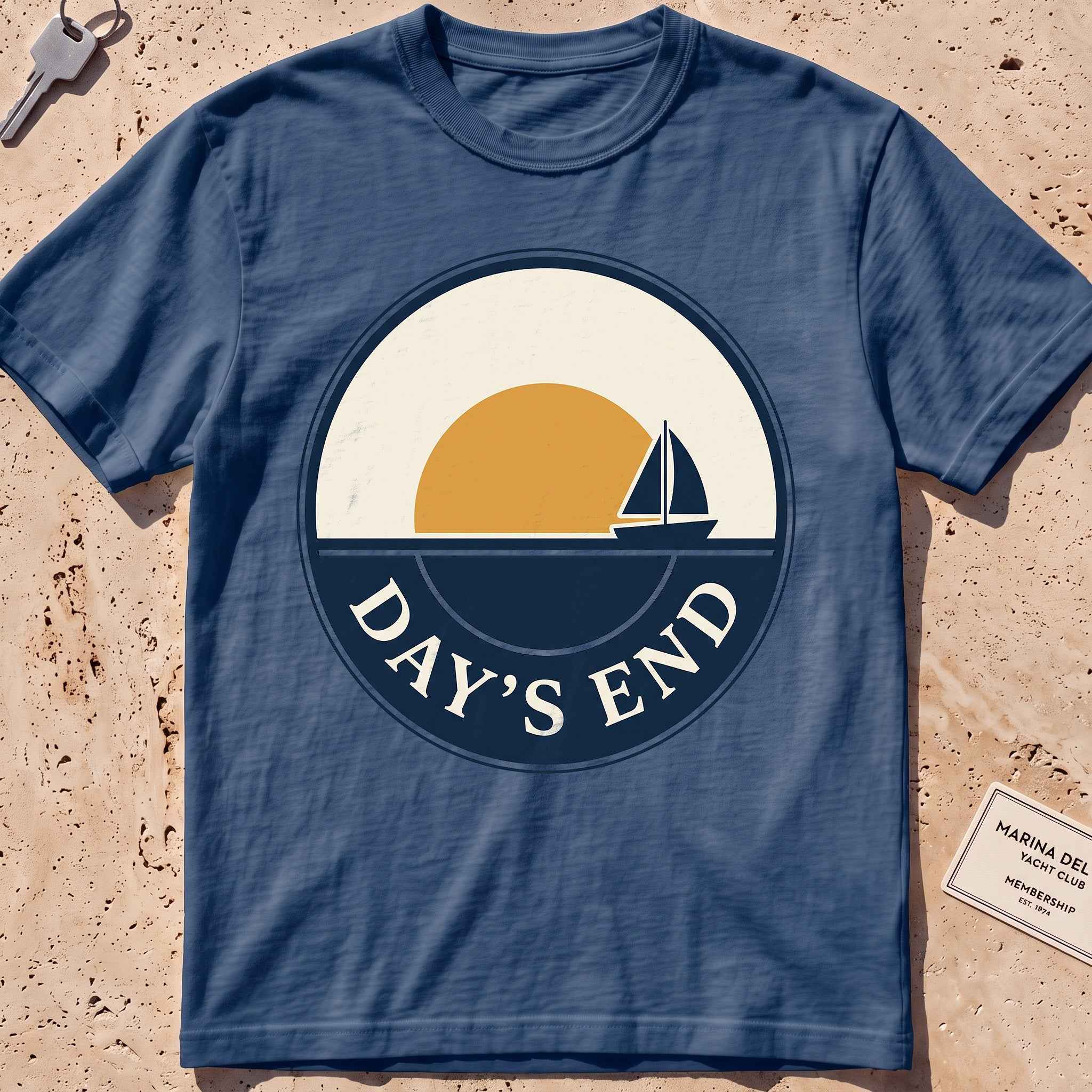 midnight heavyweight tee with a bold "Day's End" sunset badge graphic.