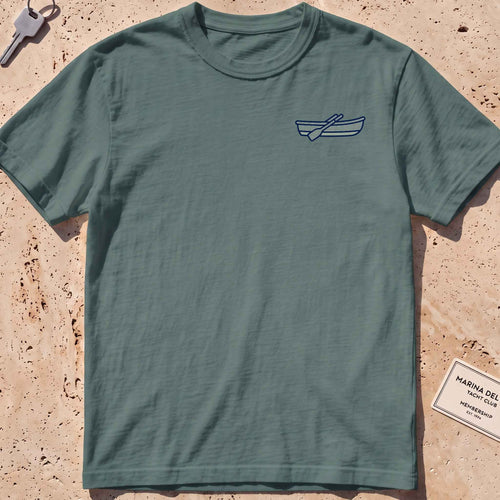blue spruce heavyweight tee with a rowing-dinghy crest graphic.