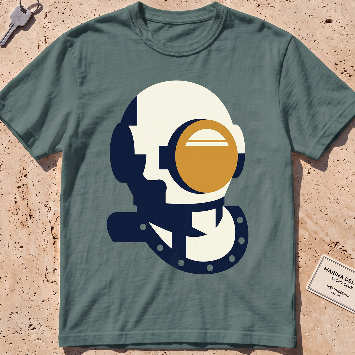 blue spruce heavyweight tee with a flat-geometric vintage dive helmet graphic.