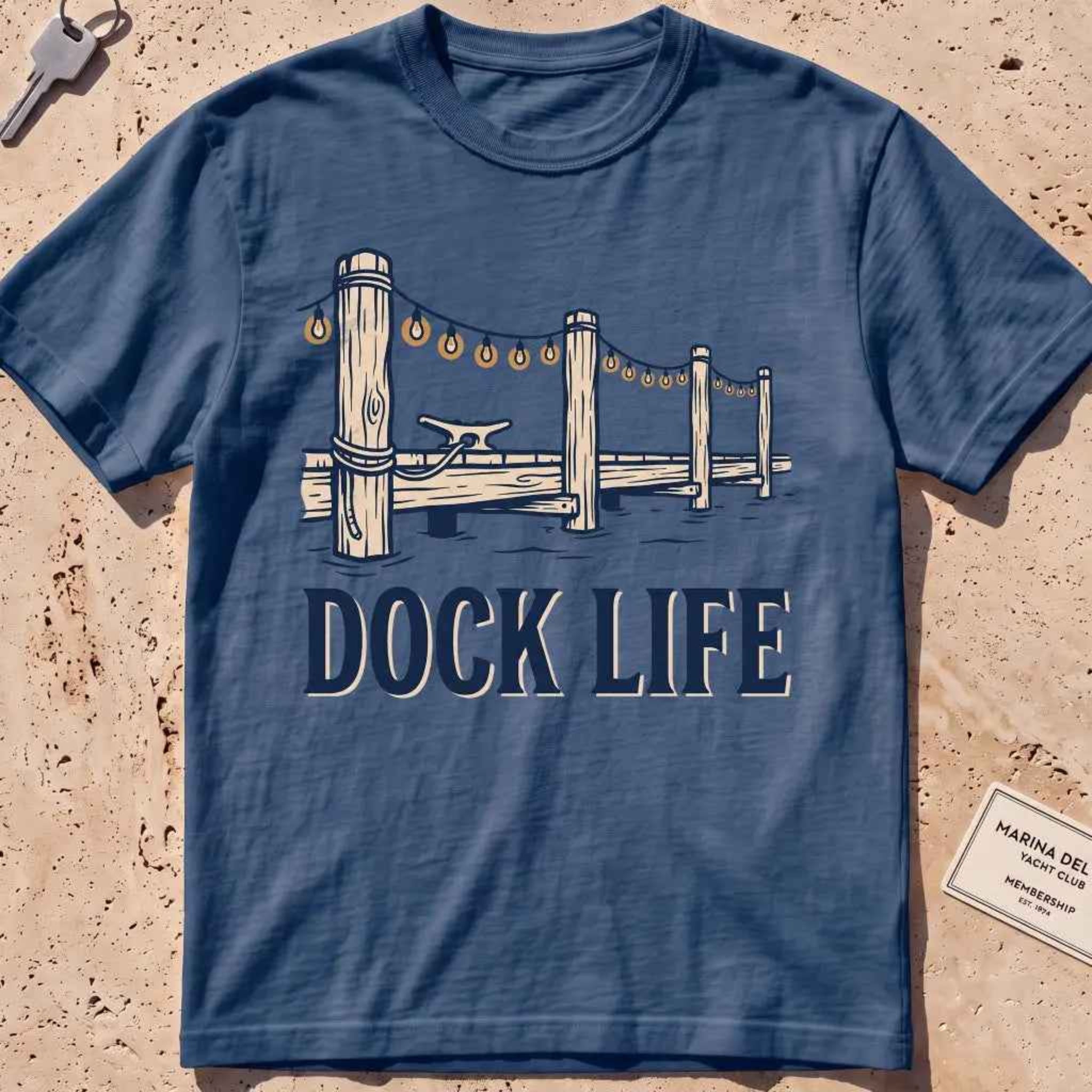 midnight heavyweight tee with dock pilings and string lights "Dock Life" graphic.