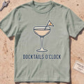 bay heavyweight tee with a cocktail coupe, burgee and "Docktails O'Clock" text.