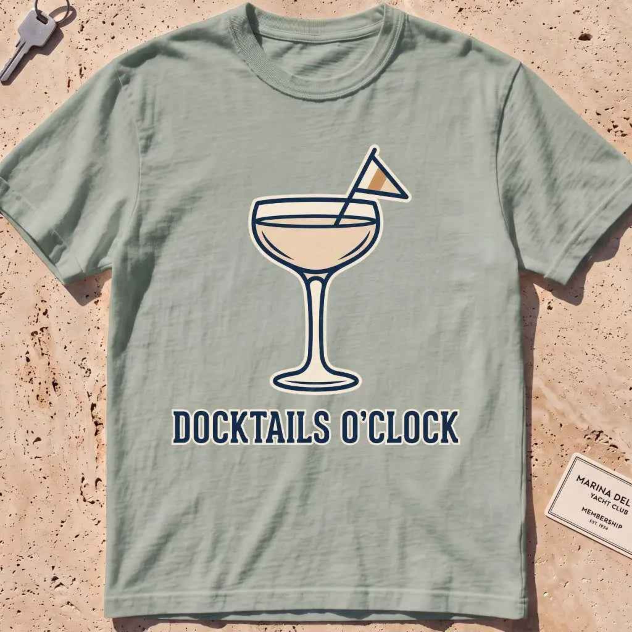 bay heavyweight tee with a cocktail coupe, burgee and "Docktails O'Clock" text.