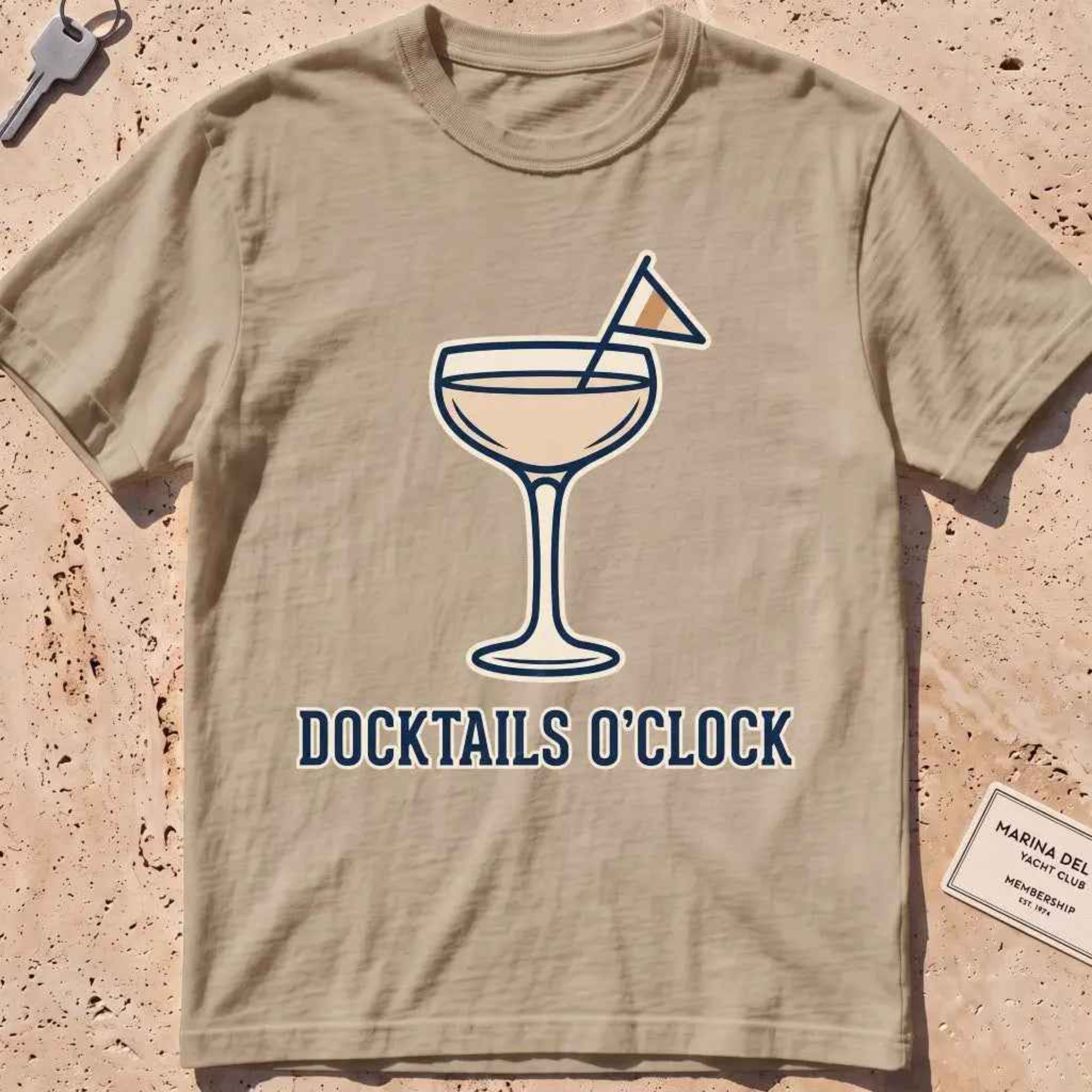 khhaki heavyweight tee with a cocktail coupe, burgee and "Docktails O'Clock" text.
